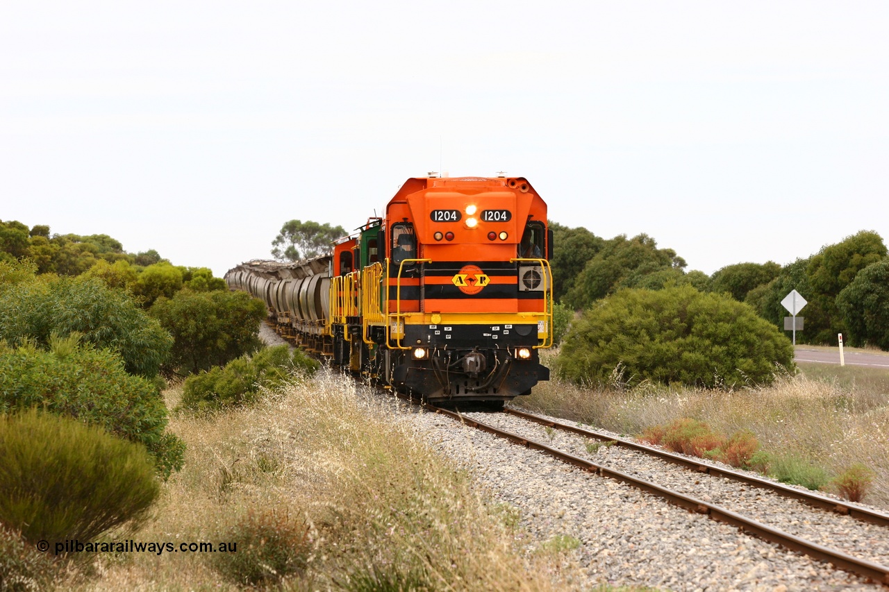 060110 2177
Near the 73 km and Cockaleechie Road grade crossing, empty grain train with ARG 1200 class unit 1204, a Clyde Engineering EMD model G12C serial 65-428, originally built for the WAGR as the final unit of fourteen A class locomotives in 1965 and sent to the Eyre Peninsula in July 2004 and two 830 class AE Goodwin built ALCo model DL531 units 842 serial 84140 ex SAR broad gauge to Eyre Peninsula in October 1987, and 851 serial 84137 new to Eyre Peninsula in 1962. [url=https://goo.gl/maps/LoznGHgHTUC2]Approx. location of image[/url].
Keywords: 1200-class;1204;Clyde-Engineering-Granville-NSW;EMD;G12C;65-428;A-class;A1514;830-class;842;851;AE-Goodwin;ALCo;DL531;84137;84140;