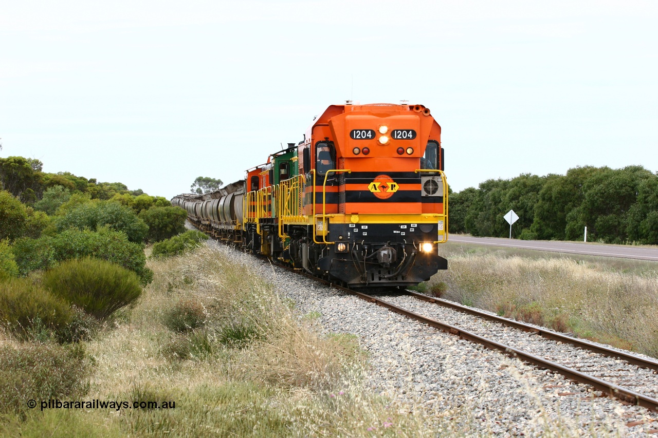 060110 2179
Near the 73 km and Cockaleechie Road grade crossing, empty grain train with ARG 1200 class unit 1204, a Clyde Engineering EMD model G12C serial 65-428, originally built for the WAGR as the final unit of fourteen A class locomotives in 1965 and sent to the Eyre Peninsula in July 2004 and two 830 class AE Goodwin built ALCo model DL531 units 842 serial 84140 ex SAR broad gauge to Eyre Peninsula in October 1987, and 851 serial 84137 new to Eyre Peninsula in 1962. [url=https://goo.gl/maps/LoznGHgHTUC2]Approx. location of image[/url].
Keywords: 1200-class;1204;Clyde-Engineering-Granville-NSW;EMD;G12C;65-428;A-class;A1514;830-class;842;851;AE-Goodwin;ALCo;DL531;84137;84140;