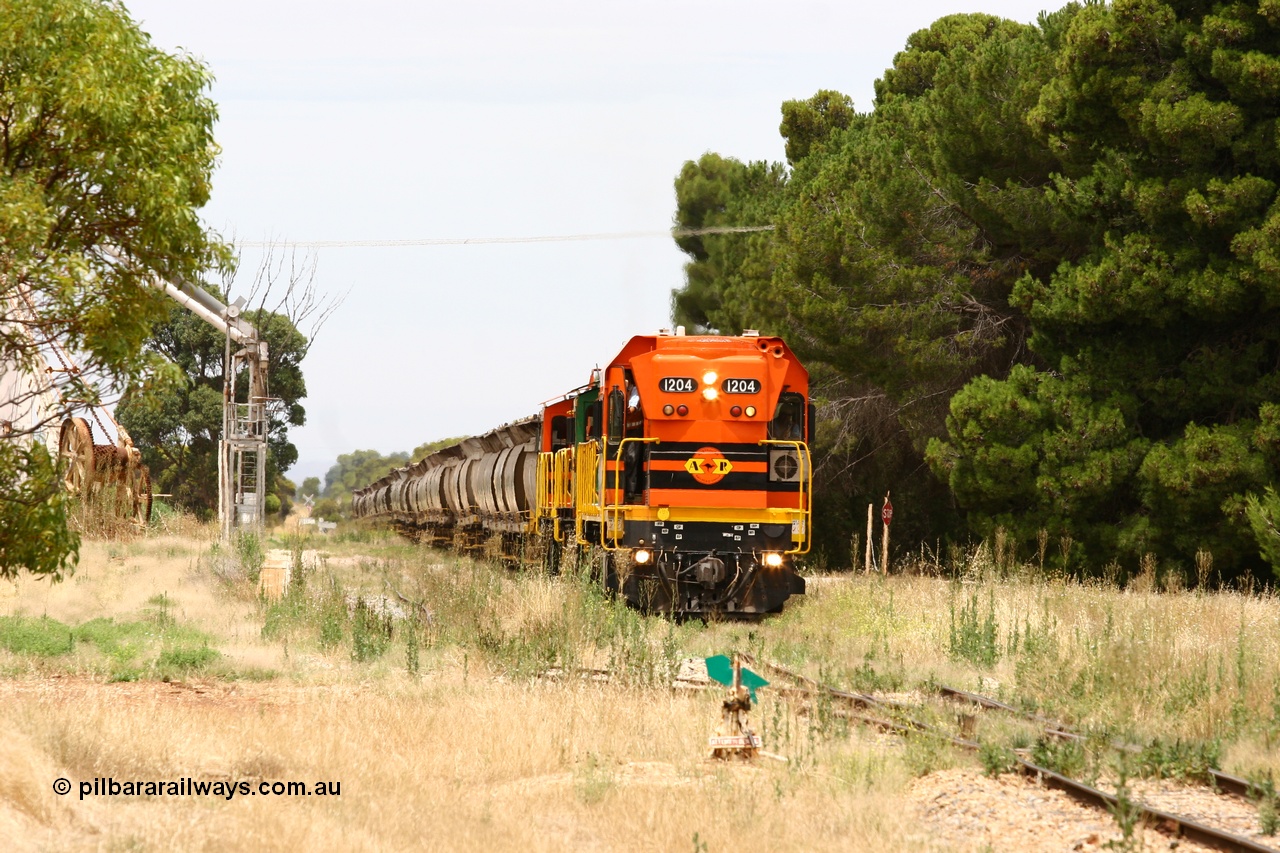 060110 2188
Yeelanna, empty grain arriving to shunt off empty hoppers as the second person exits the cab of ARG 1200 class unit 1204, a Clyde Engineering EMD model G12C serial 65-428, originally built for the WAGR as the final unit of fourteen A class locomotives in 1965. Sent to the Eyre Peninsula in July 2004. [url=https://goo.gl/maps/1JetzWBTGAw]Approx. location of image[/url].
Keywords: 1200-class;1204;Clyde-Engineering-Granville-NSW;EMD;G12C;65-428;A-class;A1514;