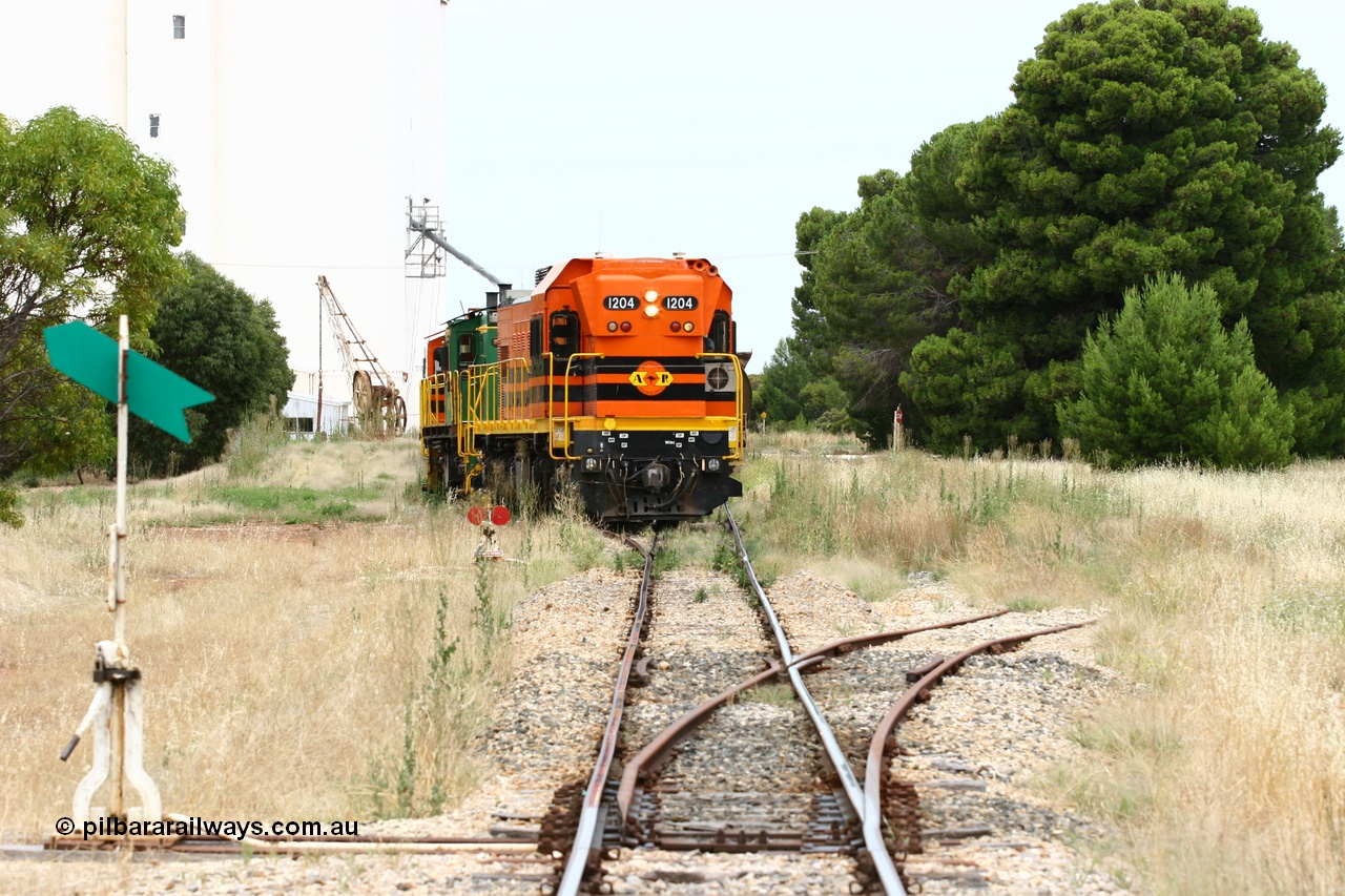 060110 2199
Yeelanna, ARG 1200 class unit 1204, a Clyde Engineering EMD model G12C serial 65-428, originally built for the WAGR as the final unit of fourteen A class locomotives in 1965 and sent to the Eyre Peninsula in July 2004 shunts a rake of waggons into the grain siding with the 5 ton crane also visible. [url=https://goo.gl/maps/1JetzWBTGAw]Approx. location of image[/url].
Keywords: 1200-class;1204;Clyde-Engineering-Granville-NSW;EMD;G12C;65-428;A-class;A1514;