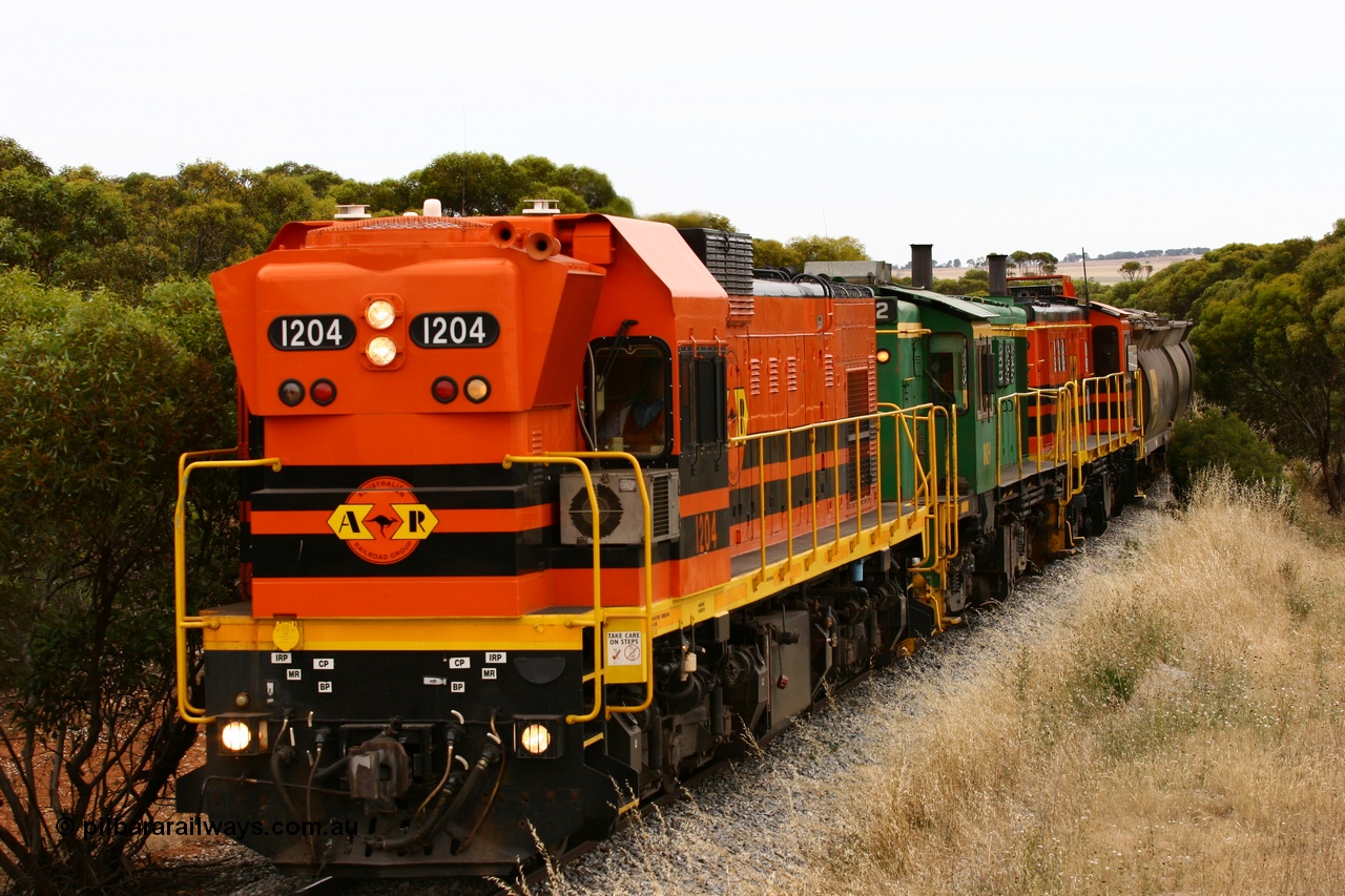 060110 2215
On the curve near the 85 km between Yeelanna and Karkoo, ARG 1200 class unit 1204, a Clyde Engineering EMD model G12C serial 65-428, originally built for the WAGR as the final unit of fourteen A class locomotives in 1965 and sent to the Eyre Peninsula in July 2004 leads an empty grain train. [url=https://goo.gl/maps/7kwfXBE6nS12]Approx. location of image[/url].
Keywords: 1200-class;1204;Clyde-Engineering-Granville-NSW;EMD;G12C;65-428;A-class;A1514;830-class;842;851;AE-Goodwin;ALCo;DL531;84137;84140;