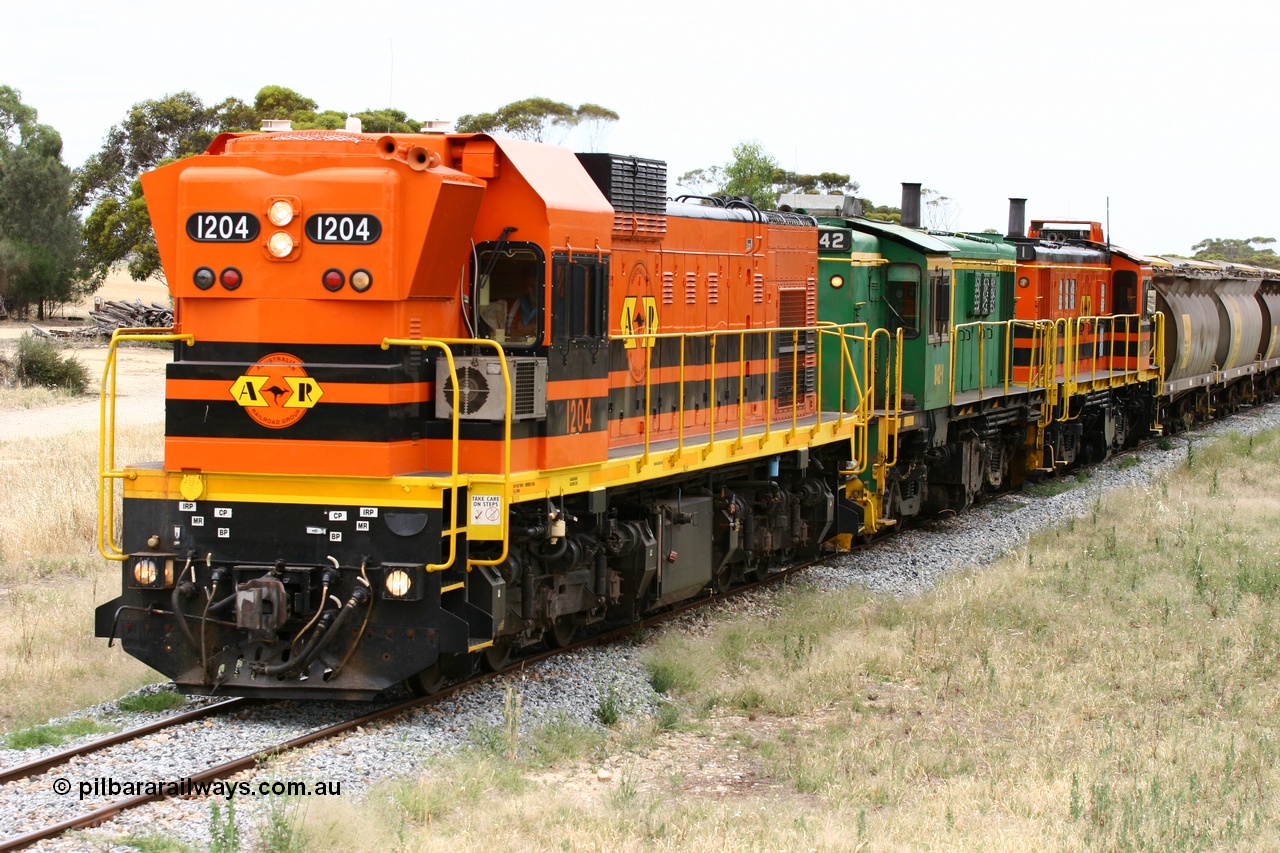 060110 2235
Karkoo, empty grain train behind ARG 1200 class unit 1204, a Clyde Engineering EMD model G12C serial 65-428, originally built for the WAGR as the final unit of fourteen A class locomotives in 1965 and sent to the Eyre Peninsula in July 2004 and two 830 class AE Goodwin built ALCo model DL531 units 842 serial 84140 ex SAR broad gauge and to Eyre Peninsula in October 1987, and 851 serial 84137 new to Eyre Peninsula in 1962. [url=https://goo.gl/maps/syz89ziXmoL2]Approx. location of image[/url].
Keywords: 1200-class;1204;Clyde-Engineering-Granville-NSW;EMD;G12C;65-428;A-class;A1514;830-class;842;851;AE-Goodwin;ALCo;DL531;84137;84140;