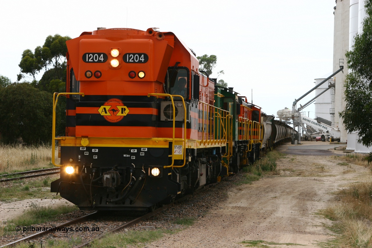 060110 2236
Lock, grain train loading underway behind ARG 1200 class unit 1204, a Clyde Engineering EMD model G12C serial 65-428, originally built for the WAGR as the final unit of fourteen A class locomotives in 1965 and sent to the Eyre Peninsula in July 2004 and two 830 class AE Goodwin built ALCo model DL531 units 842 serial 84140 ex SAR broad gauge and to Eyre Peninsula in October 1987, and 851 serial 84137 new to Eyre Peninsula in 1962. [url=https://goo.gl/maps/epTNTP7PARy]Approx. location of image[/url].
Keywords: 1200-class;1204;Clyde-Engineering-Granville-NSW;EMD;G12C;65-428;A-class;A1514;