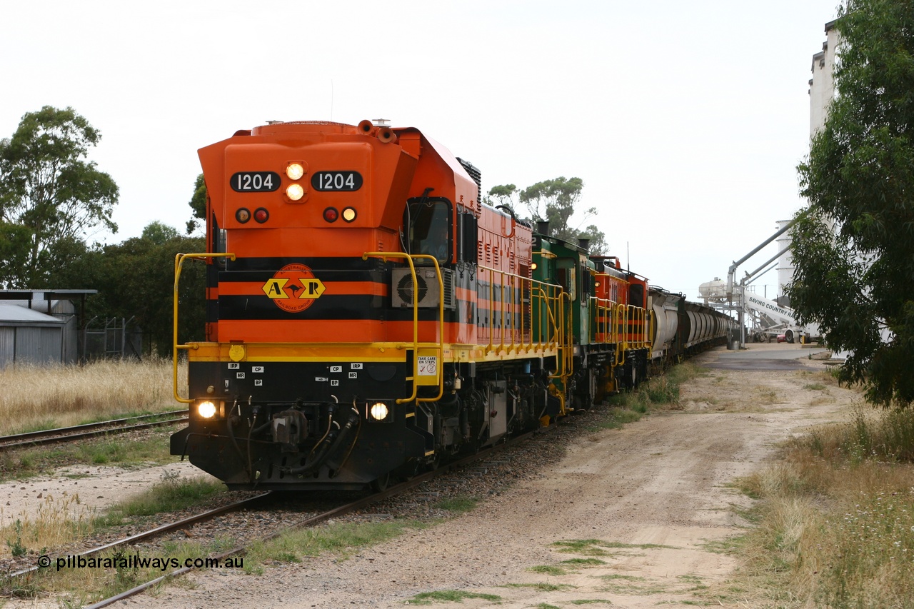 060110 2237
Lock, grain train loading underway behind ARG 1200 class unit 1204, a Clyde Engineering EMD model G12C serial 65-428, originally built for the WAGR as the final unit of fourteen A class locomotives in 1965 and sent to the Eyre Peninsula in July 2004 and two 830 class AE Goodwin built ALCo model DL531 units 842 serial 84140 ex SAR broad gauge and to Eyre Peninsula in October 1987, and 851 serial 84137 new to Eyre Peninsula in 1962. [url=https://goo.gl/maps/epTNTP7PARy]Approx. location of image[/url].
Keywords: 1200-class;1204;Clyde-Engineering-Granville-NSW;EMD;G12C;65-428;A-class;A1514;