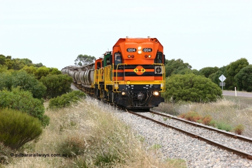 060110 2178
Near the 73 km and Cockaleechie Road grade crossing, empty grain train with ARG 1200 class unit 1204, a Clyde Engineering EMD model G12C serial 65-428, originally built for the WAGR as the final unit of fourteen A class locomotives in 1965 and sent to the Eyre Peninsula in July 2004 and two 830 class AE Goodwin built ALCo model DL531 units 842 serial 84140 ex SAR broad gauge to Eyre Peninsula in October 1987, and 851 serial 84137 new to Eyre Peninsula in 1962. [url=https://goo.gl/maps/LoznGHgHTUC2]Approx. location of image[/url].
Keywords: 1200-class;1204;Clyde-Engineering-Granville-NSW;EMD;G12C;65-428;A-class;A1514;830-class;842;851;AE-Goodwin;ALCo;DL531;84137;84140;