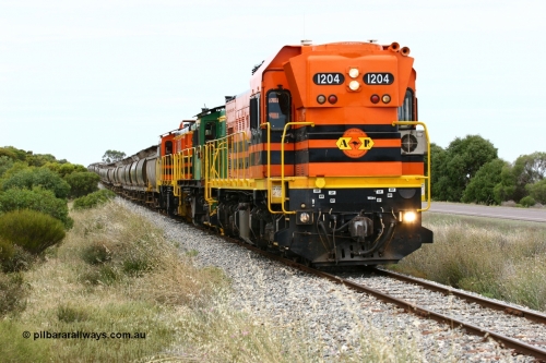 060110 2181
Near the 73 km and Cockaleechie Road grade crossing, empty grain train with ARG 1200 class unit 1204, a Clyde Engineering EMD model G12C serial 65-428, originally built for the WAGR as the final unit of fourteen A class locomotives in 1965 and sent to the Eyre Peninsula in July 2004 and two 830 class AE Goodwin built ALCo model DL531 units 842 serial 84140 ex SAR broad gauge to Eyre Peninsula in October 1987, and 851 serial 84137 new to Eyre Peninsula in 1962. [url=https://goo.gl/maps/LoznGHgHTUC2]Approx. location of image[/url].
Keywords: 1200-class;1204;Clyde-Engineering-Granville-NSW;EMD;G12C;65-428;A-class;A1514;830-class;842;851;AE-Goodwin;ALCo;DL531;84137;84140;