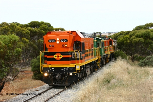 060110 2213
On the curve near the 85 km between Yeelanna and Karkoo, ARG 1200 class unit 1204, a Clyde Engineering EMD model G12C serial 65-428, originally built for the WAGR as the final unit of fourteen A class locomotives in 1965 and sent to the Eyre Peninsula in July 2004 leads an empty grain train. [url=https://goo.gl/maps/7kwfXBE6nS12]Approx. location of image[/url].
Keywords: 1200-class;1204;Clyde-Engineering-Granville-NSW;EMD;G12C;65-428;A-class;A1514;