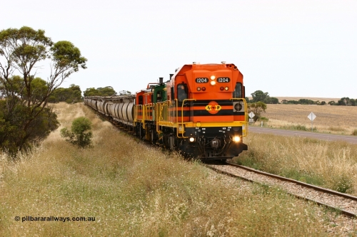 060110 2223
At the Procter Rd grade crossing about halfway between Yeelanna and Karkoo, empty grain train behind ARG 1200 class unit 1204, a Clyde Engineering EMD model G12C serial 65-428, originally built for the WAGR as the final unit of fourteen A class locomotives in 1965 and sent to the Eyre Peninsula in July 2004 and two 830 class AE Goodwin built ALCo model DL531 units 842 serial 84140 ex SAR broad gauge and to Eyre Peninsula in October 1987, and 851 serial 84137 new to Eyre Peninsula in 1962. [url=https://goo.gl/maps/DzBHRaUezTF2]Approx. location of image[/url].
Keywords: 1200-class;1204;Clyde-Engineering-Granville-NSW;EMD;G12C;65-428;A-class;A1514;