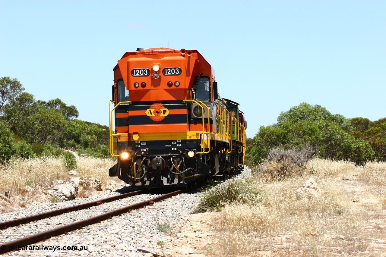 060111 2254
Tooligie, a kilometre south with empty grain train ARG 1200 class unit 1203, a Clyde Engineering EMD model G12C serial 65-427, one of fourteen originally built between 1960-65 for WAGR as their A class A 1513, fitted with dynamic brakes and financed by Western Mining Corporation, started working on the Eyre Peninsula in November 2004 leads an empty grain train north. 11th January 2006.
Keywords: 1200-class;1203;Clyde-Engineering-Granville-NSW;EMD;G12C;65-427;A-class;A1513;