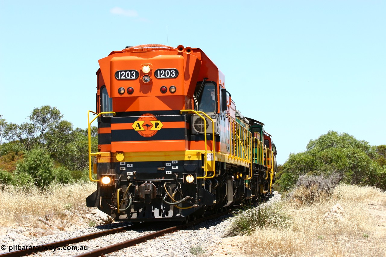 060111 2255
Tooligie, a kilometre south with empty grain train ARG 1200 class unit 1203, a Clyde Engineering EMD model G12C serial 65-427, one of fourteen originally built between 1960-65 for WAGR as their A class A 1513, fitted with dynamic brakes and financed by Western Mining Corporation, started working on the Eyre Peninsula in November 2004 leads an empty grain train north. 11th January 2006.
Keywords: 1200-class;1203;Clyde-Engineering-Granville-NSW;EMD;G12C;65-427;A-class;A1513;