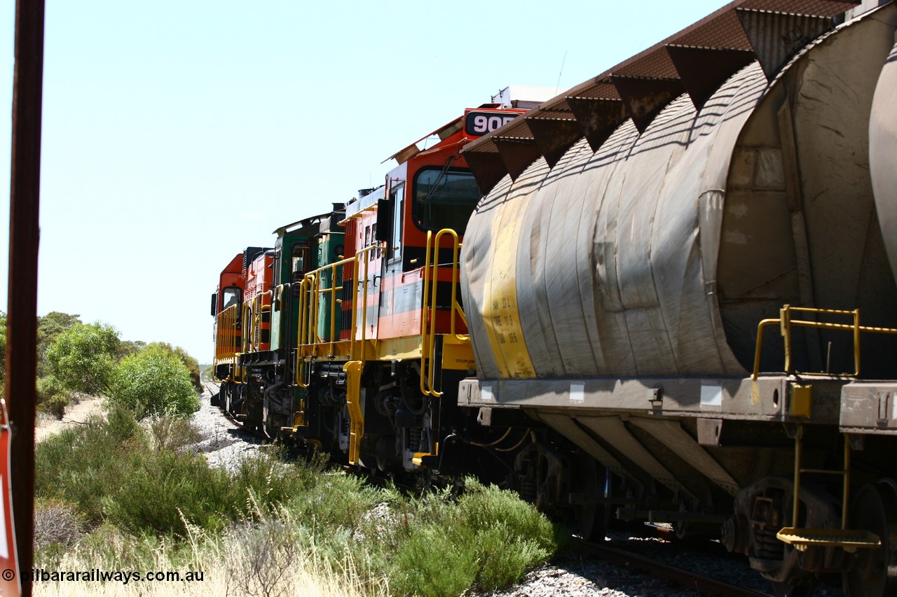 060111 2264
Tooligie, at the Tooligie Road grade crossing, the empty grain train continues north towards Murdinga. 11th January 2006.
