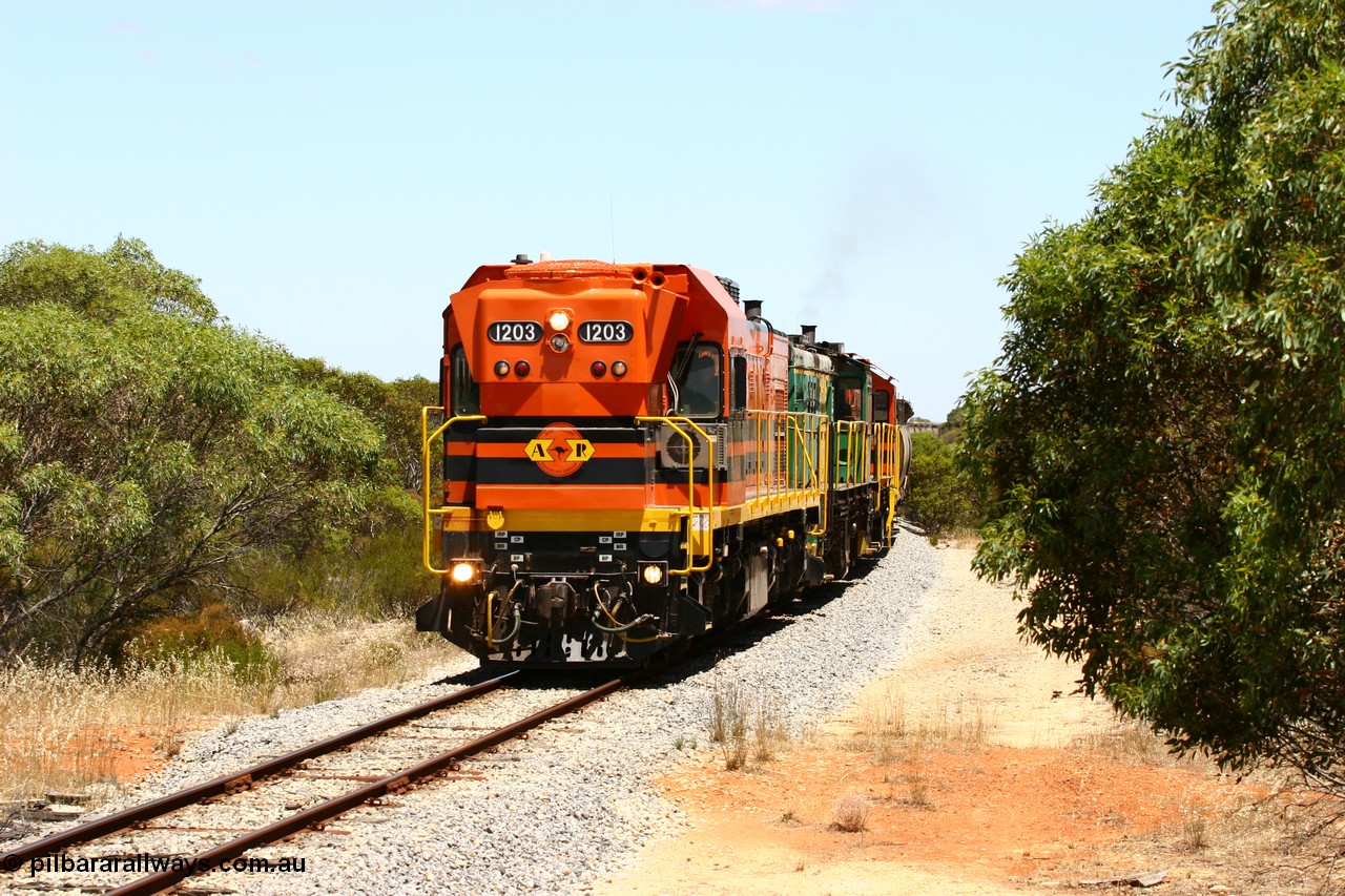 060111 2268
Tooligie, empty grain train running north behind ARG 1200 class unit 1203, a Clyde Engineering EMD model G12C serial 65-427, one of fourteen originally built between 1960-65 for WAGR as their A class A 1513, fitted with dynamic brakes and financed by Western Mining Corporation, started working on the Eyre Peninsula in November 2004. 11th January 2006.
Keywords: 1200-class;1203;Clyde-Engineering-Granville-NSW;EMD;G12C;65-427;A-class;A1513;