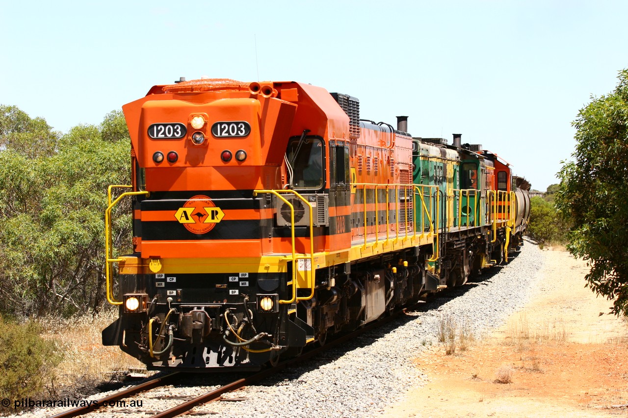 060111 2270
Tooligie, empty grain train running north behind ARG 1200 class unit 1203, a Clyde Engineering EMD model G12C serial 65-427, one of fourteen originally built between 1960-65 for WAGR as their A class A 1513, fitted with dynamic brakes and financed by Western Mining Corporation, started working on the Eyre Peninsula in November 2004. 11th January 2006.
Keywords: 1200-class;1203;Clyde-Engineering-Granville-NSW;EMD;G12C;65-427;A-class;A1513;