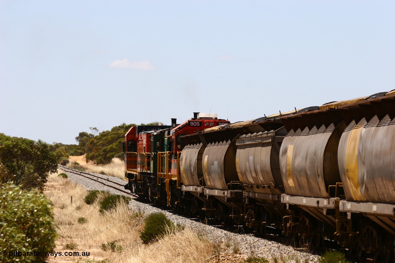 060111 2277
Peachna, Tooligie Hill Road grade crossing, empty grain train running north behind ARG 1200 class unit 1203, a Clyde Engineering EMD model G12C serial 65-427, one of fourteen originally built between 1960-65 for WAGR as their A class A 1513, fitted with dynamic brakes and financed by Western Mining Corporation, started working on the Eyre Peninsula in November 2004. 11th January 2006.
