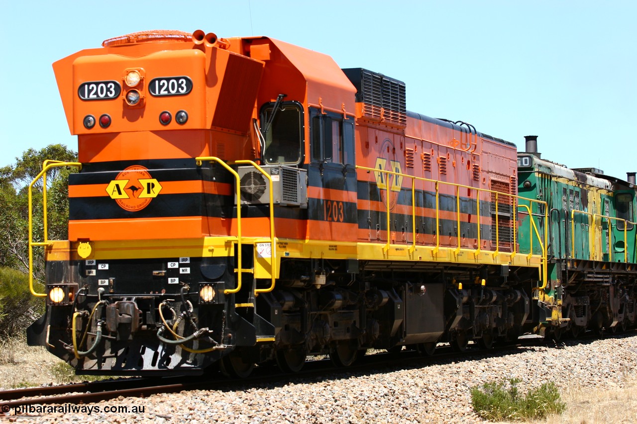 060111 2281
Peachna, two kilometres north of the former station site empty grain train running north behind ARG 1200 class unit 1203, a Clyde Engineering EMD model G12C serial 65-427, one of fourteen originally built between 1960-65 for WAGR as their A class A 1513, fitted with dynamic brakes and financed by Western Mining Corporation, started working on the Eyre Peninsula in November 2004. 11th January 2006.
Keywords: 1200-class;1203;Clyde-Engineering-Granville-NSW;EMD;G12C;65-427;A-class;A1513;