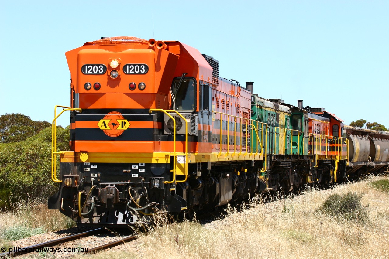 060111 2285
Murdinga, rounding the curve before entering the station environs empty grain train running north behind ARG 1200 class unit 1203, a Clyde Engineering EMD model G12C serial 65-427, one of fourteen originally built between 1960-65 for WAGR as their A class A 1513, fitted with dynamic brakes and financed by Western Mining Corporation, started working on the Eyre Peninsula in November 2004. 11th January 2006.
Keywords: 1200-class;1203;Clyde-Engineering-Granville-NSW;EMD;G12C;65-427;A-class;A1513;