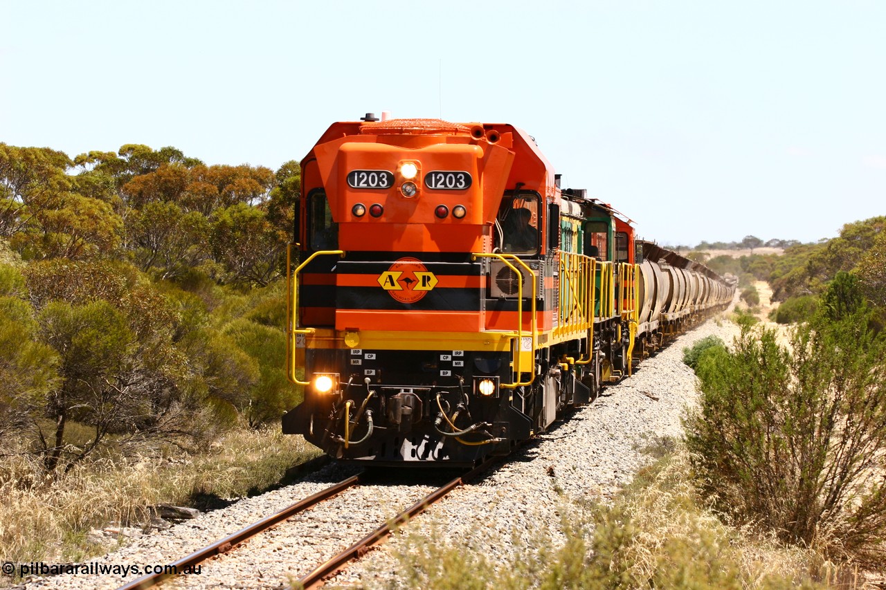 060111 2292
Warrachie, ARG 1200 class unit 1203, a Clyde Engineering EMD model G12C serial 65-427, one of fourteen originally built between 1960-65 for WAGR as their A class A 1513, fitted with dynamic brakes and financed by Western Mining Corporation, started working on the Eyre Peninsula in November 2004 leads an empty grain train between Murdinga and Lock. 11th January 2006.
Keywords: 1200-class;1203;Clyde-Engineering-Granville-NSW;EMD;G12C;65-427;A-class;A1513;