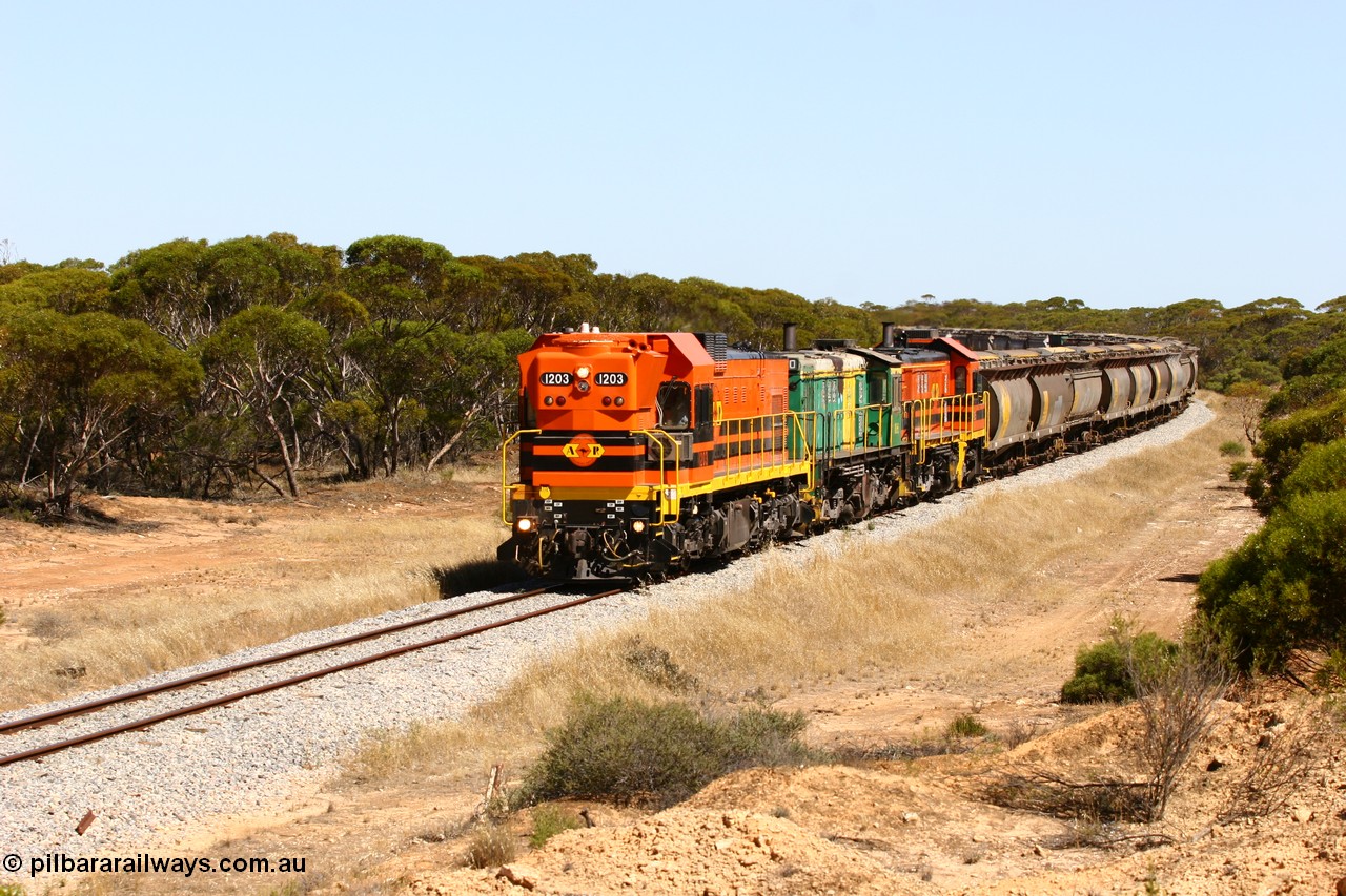 060111 2318
Nantuma, Clyde Engineering built EMD G12C model loco 1203 serial 65-427 leads two ALCo units 850 and 905 as they round the bend just north of the old station site at the 183 km. Their next shunt will be Warramboo. 11th January 2006.
Keywords: 1200-class;1203;Clyde-Engineering-Granville-NSW;EMD;G12C;65-427;A-class;A1513;