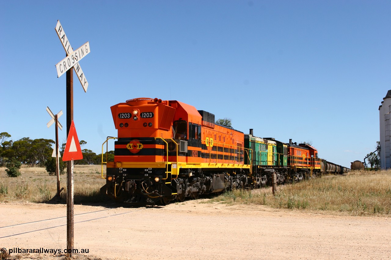 060111 2326
Warramboo, Kimba Road grade crossing, ARG 1200 class unit 1203, a Clyde Engineering EMD model G12C serial 65-427, one of fourteen originally built between 1960-65 for WAGR as their A class A 1513, fitted with dynamic brakes and financed by Western Mining Corporation, started working on the Eyre Peninsula in November 2004, here shunting off the grain siding and back to the mainline to resume the journey north. 11th January 2006.
Keywords: 1200-class;1203;Clyde-Engineering-Granville-NSW;EMD;G12C;65-427;A-class;A1513;