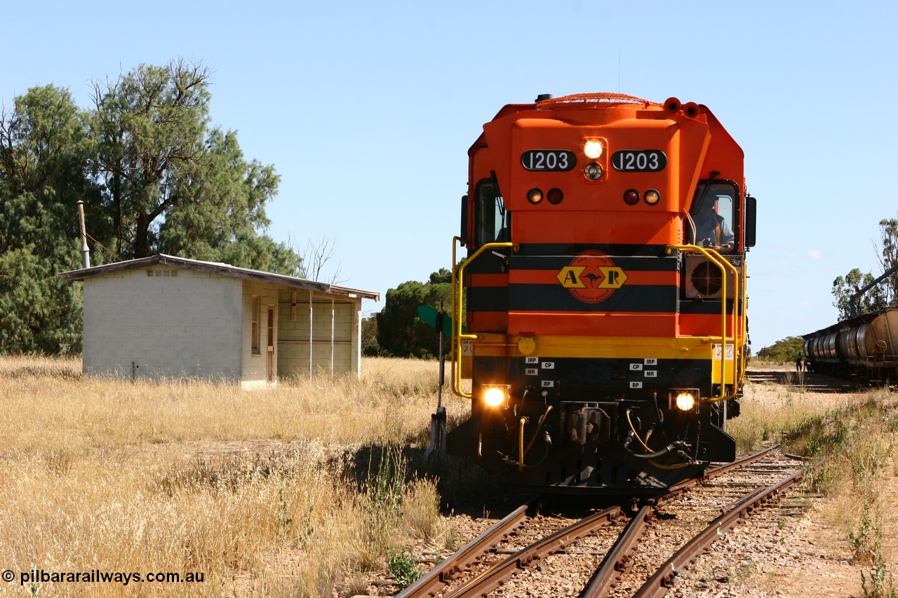 060111 2328
Warramboo, located at the 190.2 km and opened with the line in May 1913, with now disused station building on the left, Clyde Engineering built EMD G12C model loco 1203 serial 65-427 stands on the mainline as loading on the grain siding has started. 11th January 2006.
Keywords: 1200-class;1203;Clyde-Engineering-Granville-NSW;EMD;G12C;65-427;A-class;A1513;