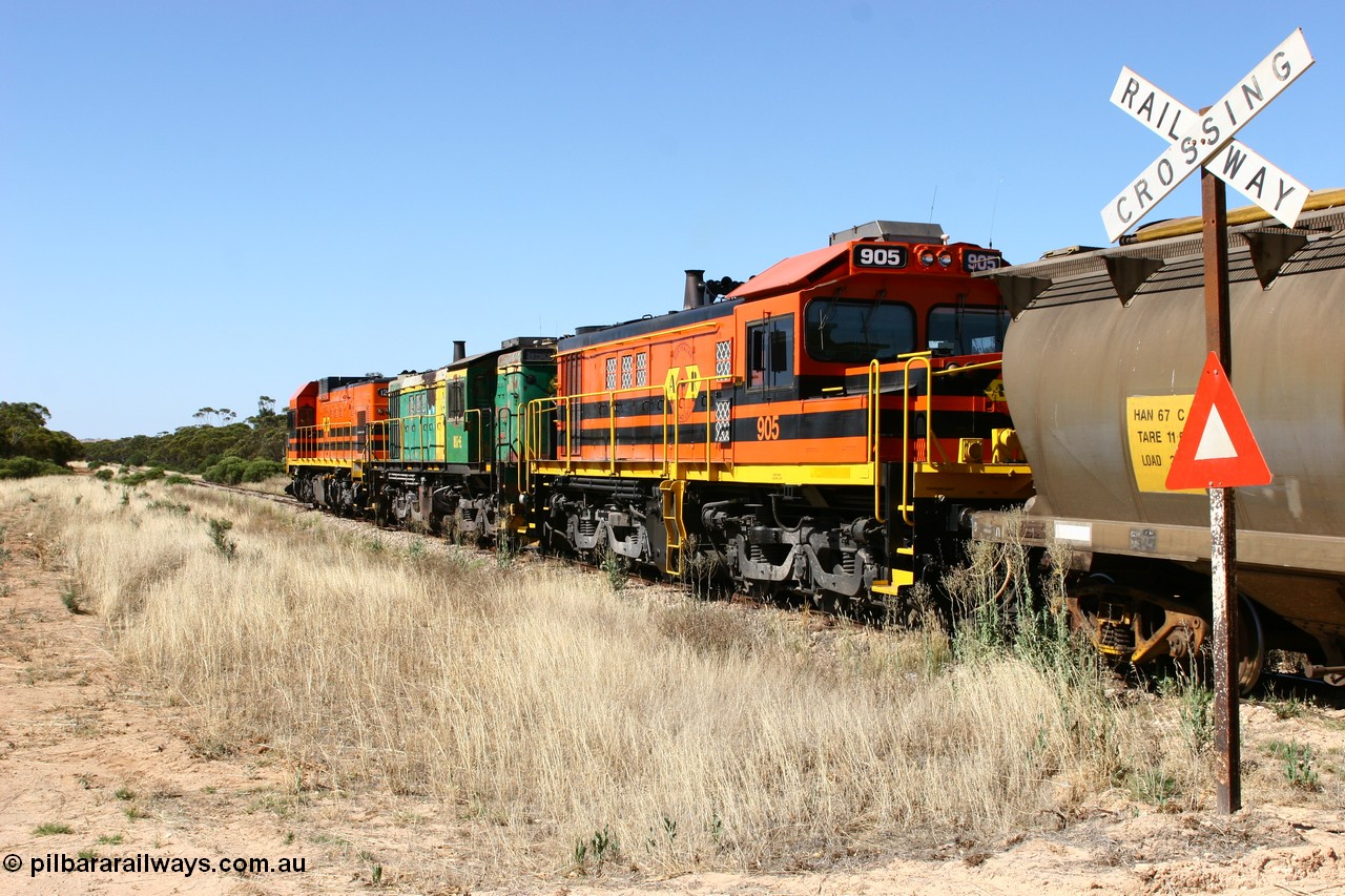 060111 2338
Warramboo, ARG 900 class unit 905, originally built by AE Goodwin as 830 class unit 836 serial 83727, converted to DA class DA 6 by Australian National at Port Augusta workshops for driver only operation in 1996. Trailing unit in a north bound grain train as it crosses Kimba Road grade crossing. 11th January 2006.
Keywords: 900-class;905;83727;830-class;836;AE-Goodwin;ALCo;DL531;DA-class;DA6;