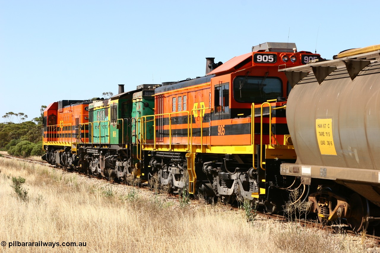 060111 2339
Warramboo, ARG 900 class unit 905, originally built by AE Goodwin as 830 class unit 836 serial 83727, converted to DA class DA 6 by Australian National at Port Augusta workshops for driver only operation in 1996. Trailing unit in a north bound grain train as it crosses Kimba Road grade crossing. 11th January 2006.
Keywords: 900-class;905;AE-Goodwin;ALCo;DL531;83727;830-class;836;DA-class;DA6;