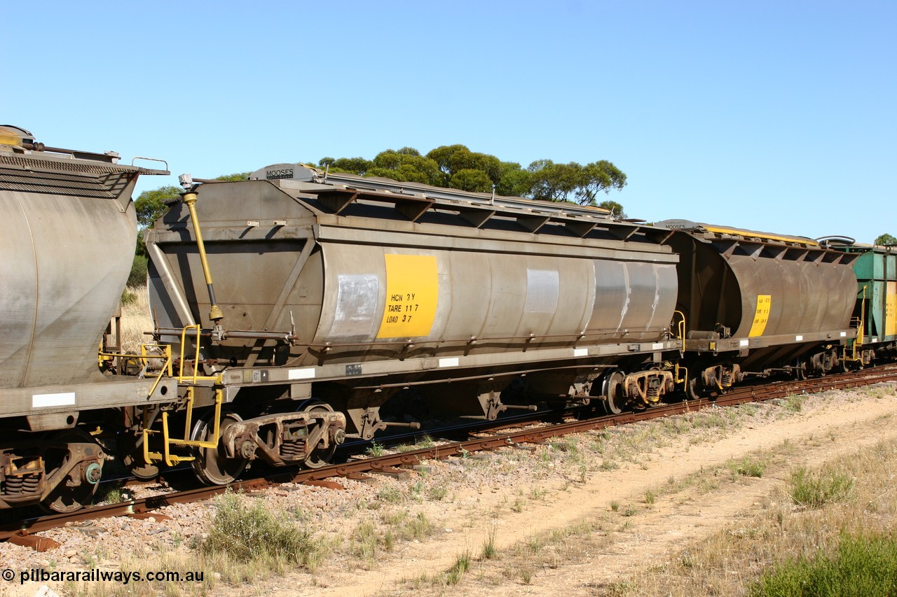 060111 2351
Kyancutta, HCN type bogie wheat waggon HCN 3 shows signs of new panel work, was modified at Islington Workshops in 1978-80 and started life as a Tulloch built NHB type iron ore hopper for the CR on the North Australia Railway in 1968-69, and an SAR built HAN type HAN 13 part of an empty grain train. 11th January 2006.
Keywords: HCN-type;HCN3;SAR-Islington-WS;rebuild;Tulloch-Ltd-NSW;NHB-type;NHB1595;