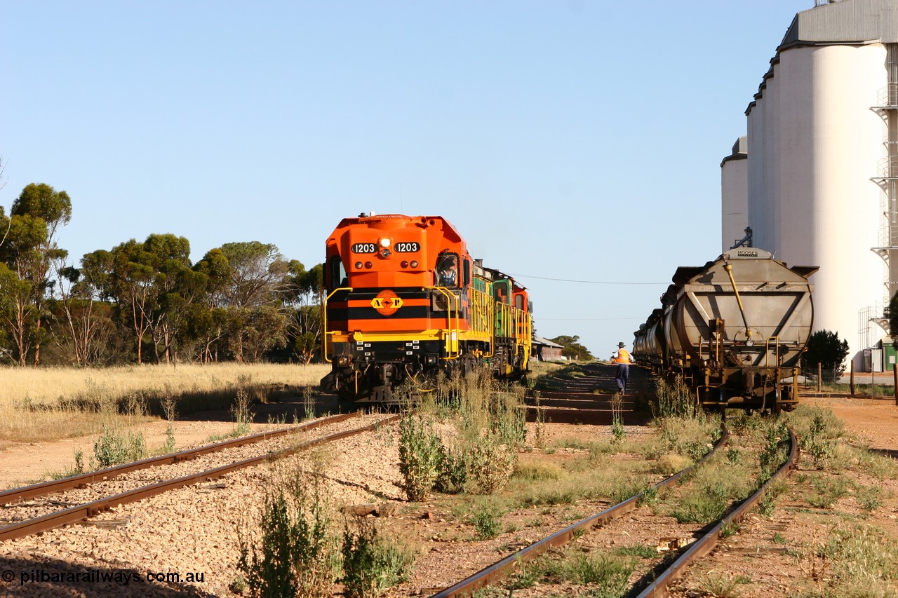 060111 2413
Wudinna, ARG 1200 class unit 1203, a Clyde Engineering EMD model G12C serial 65-427, one of fourteen originally built between 1960-65 for WAGR as their A class A 1513, fitted with dynamic brakes and financed by Western Mining Corporation, started working on the Eyre Peninsula in November 2004, 1203 and two ALCo units 850 and 905 shunt back down the mainline at Wudinna as they run round their consist. 11th January 2006.
Keywords: 1200-class;1203;Clyde-Engineering-Granville-NSW;EMD;G12C;65-427;A-class;A1513;