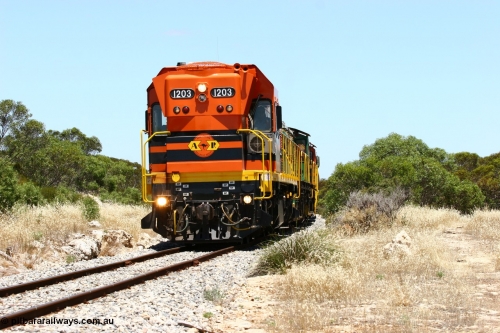 060111 2254
Tooligie, a kilometre south with empty grain train ARG 1200 class unit 1203, a Clyde Engineering EMD model G12C serial 65-427, one of fourteen originally built between 1960-65 for WAGR as their A class A 1513, fitted with dynamic brakes and financed by Western Mining Corporation, started working on the Eyre Peninsula in November 2004 leads an empty grain train north. 11th January 2006.
Keywords: 1200-class;1203;Clyde-Engineering-Granville-NSW;EMD;G12C;65-427;A-class;A1513;