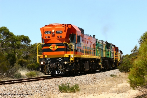 060111 2280
Peachna, two kilometres north of the former station site empty grain train running north behind ARG 1200 class unit 1203, a Clyde Engineering EMD model G12C serial 65-427, one of fourteen originally built between 1960-65 for WAGR as their A class A 1513, fitted with dynamic brakes and financed by Western Mining Corporation, started working on the Eyre Peninsula in November 2004. 11th January 2006.
Keywords: 1200-class;1203;Clyde-Engineering-Granville-NSW;EMD;G12C;65-427;A-class;A1513;