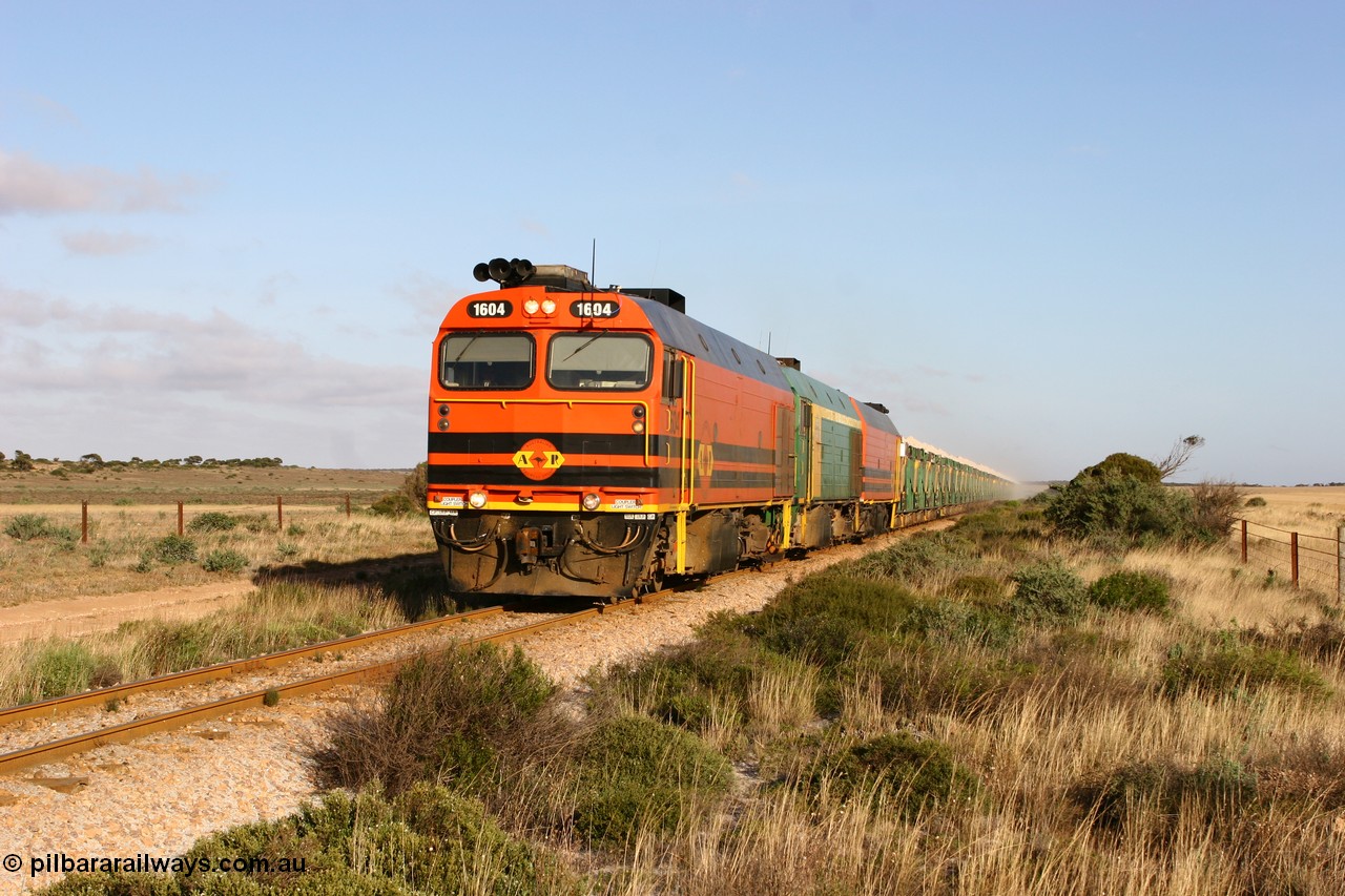 060113 2419
Ceduna, loaded gypsum train 6DD2 stirs up the dust behind the triple Clyde Engineering EMD JL22C model 1600 / NJ class combination of 1604 serial 71-731 and originally NJ 4, NJ 3 serial 71-730 and 1601 serial 71-728 class leader NJ 1, all three units started on the Central Australia Railway in 1971 and were transferred to the Eyre Peninsula in 1981. 08:10 AM on the Friday the 13th January 2006.
Keywords: 1600-class;1604;71-731;Clyde-Engineering-Granville-NSW;EMD;JL22C;NJ-class;NJ4;