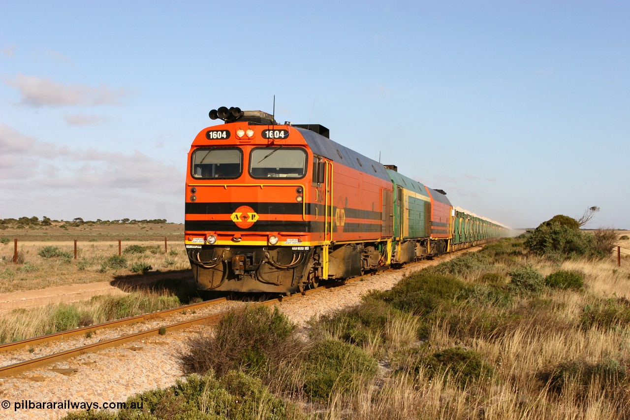 060113 2420
Ceduna, loaded gypsum train 6DD2 stirs up the dust behind the triple Clyde Engineering EMD JL22C model 1600 / NJ class combination of 1604 serial 71-731 and originally NJ 4, NJ 3 serial 71-730 and 1601 serial 71-728 class leader NJ 1, all three units started on the Central Australia Railway in 1971 and were transferred to the Eyre Peninsula in 1981. 08:10 AM on the Friday the 13th January 2006.
Keywords: 1600-class;1604;71-731;Clyde-Engineering-Granville-NSW;EMD;JL22C;NJ-class;NJ4;