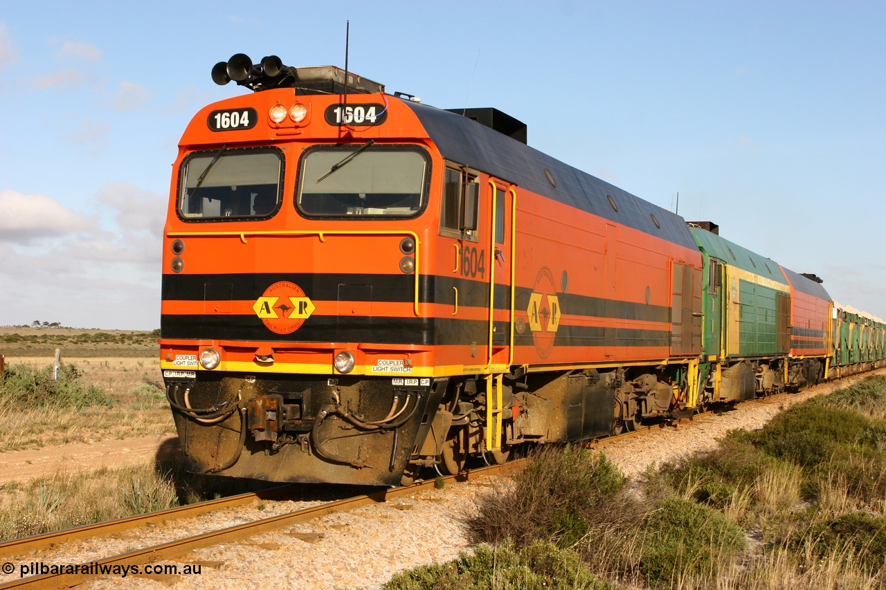 060113 2422
Ceduna, loaded gypsum train 6DD2 stirs up the dust behind the triple Clyde Engineering EMD JL22C model 1600 / NJ class combination of 1604 serial 71-731 and originally NJ 4, NJ 3 serial 71-730 and 1601 serial 71-728 class leader NJ 1, all three units started on the Central Australia Railway in 1971 and were transferred to the Eyre Peninsula in 1981. 08:10 AM on the Friday the 13th January 2006.
Keywords: 1600-class;1604;71-731;Clyde-Engineering-Granville-NSW;EMD;JL22C;NJ-class;NJ4;