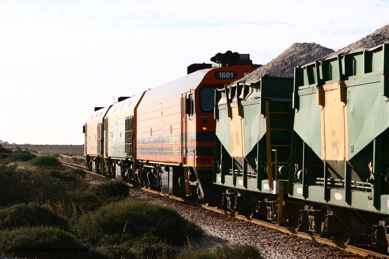 060113 2426
Ceduna, loaded gypsum train 6DD2 behind the triple Clyde Engineering EMD JL22C model 1600 / NJ class combination of 1604 serial 71-731 and originally NJ 4, NJ 3 serial 71-730 and 1601 serial 71-728 class leader NJ 1, all three units started on the Central Australia Railway in 1971 and were transferred to the Eyre Peninsula in 1981. 08:10 AM on the Friday the 13th January 2006.
Keywords: 1600-class;1601;Clyde-Engineering-Granville-NSW;EMD;JL22C;NJ-class;NJ1;71-728;