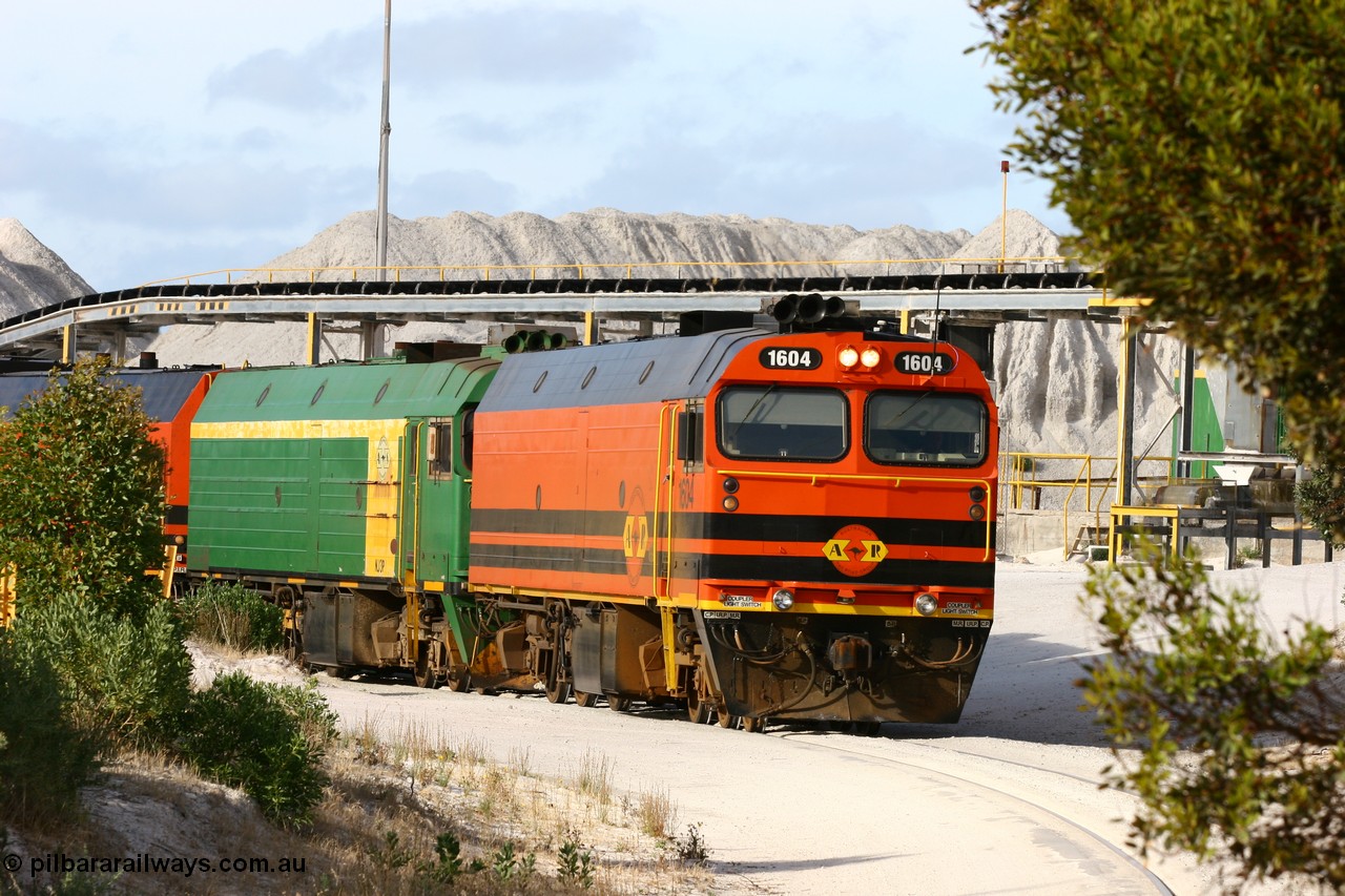 060113 2431
Thevenard, at the Gypsum Resources Australian (GRA) gypsum unloading site, 1604 leads a triple consist of Clyde Engineering EMD JL22C model 1600 / NJ class combination of 1604 serial 71-731 and originally NJ 4, NJ 3 serial 71-730 and 1601 serial 71-728 class leader NJ 1, all three units started on the Central Australia Railway in 1971 and were transferred to the Eyre Peninsula in 1981. 1604 and 1601 both renumbered in 2004. Friday 13th January 2006.
Keywords: 1600-class;1604;Clyde-Engineering-Granville-NSW;EMD;JL22C;71-731;NJ-class;NJ4;