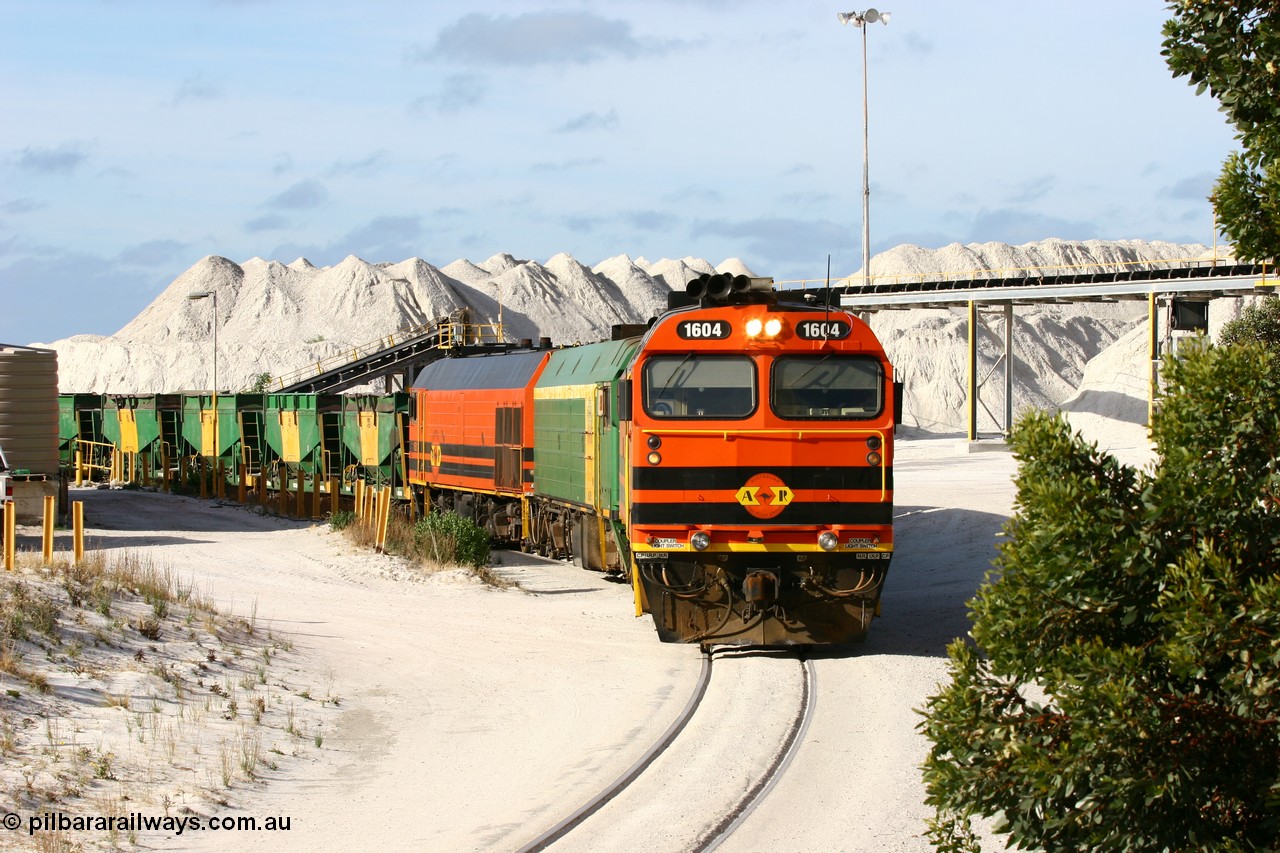 060113 2432
Thevenard, at the Gypsum Resources Australian (GRA) gypsum unloading site, 1604 leads a triple consist of Clyde Engineering EMD JL22C model 1600 / NJ class combination of 1604 serial 71-731 and originally NJ 4, NJ 3 serial 71-730 and 1601 serial 71-728 class leader NJ 1, all three units started on the Central Australia Railway in 1971 and were transferred to the Eyre Peninsula in 1981. 1604 and 1601 both renumbered in 2004. Friday 13th January 2006.
Keywords: 1600-class;1604;71-731;Clyde-Engineering-Granville-NSW;EMD;JL22C;NJ-class;NJ4;