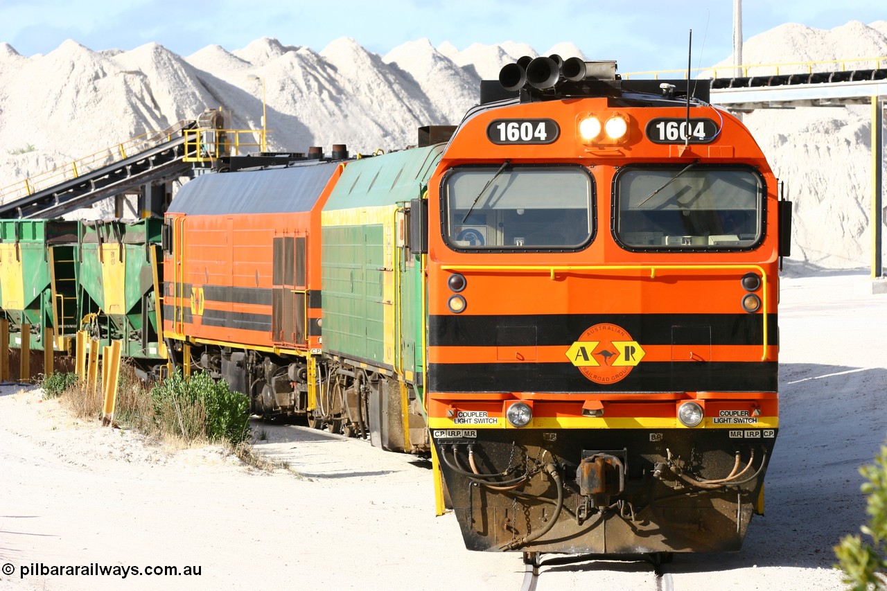 060113 2435
Thevenard, at the Gypsum Resources Australian (GRA) gypsum unloading site, 1604 leads a triple consist of Clyde Engineering EMD JL22C model 1600 / NJ class combination of 1604 serial 71-731 and originally NJ 4, NJ 3 serial 71-730 and 1601 serial 71-728 class leader NJ 1, all three units started on the Central Australia Railway in 1971 and were transferred to the Eyre Peninsula in 1981. 1604 and 1601 both renumbered in 2004. Friday 13th January 2006.
Keywords: 1600-class;1604;Clyde-Engineering-Granville-NSW;EMD;JL22C;71-731;NJ-class;NJ4;