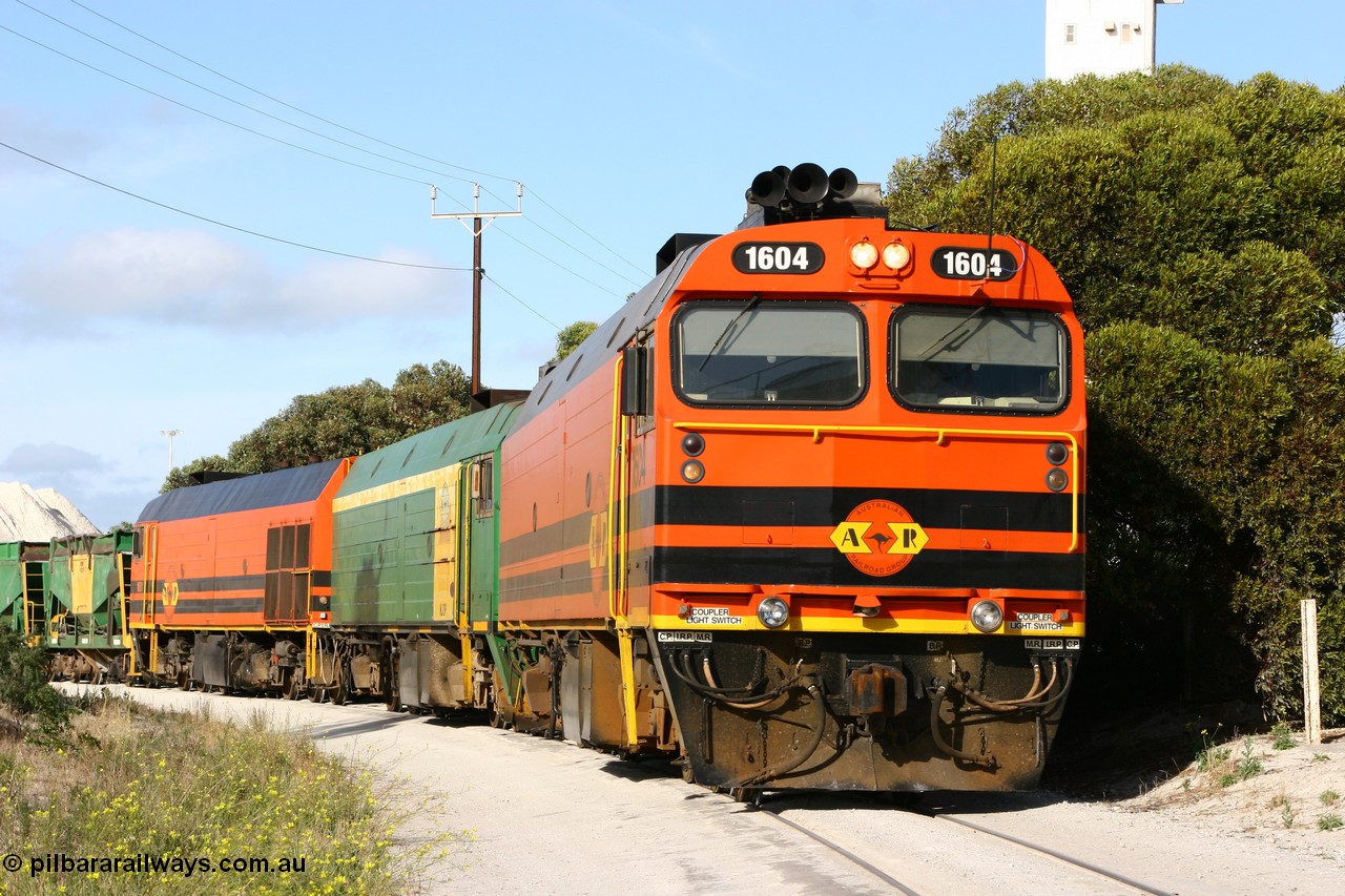 060113 2436
Thevenard, at the Gypsum Resources Australian (GRA) gypsum unloading site, 1604 leads a triple consist of Clyde Engineering EMD JL22C model 1600 / NJ class combination of 1604 serial 71-731 and originally NJ 4, NJ 3 serial 71-730 and 1601 serial 71-728 class leader NJ 1, all three units started on the Central Australia Railway in 1971 and were transferred to the Eyre Peninsula in 1981. 1604 and 1601 both renumbered in 2004. Friday 13th January 2006.
Keywords: 1600-class;1604;Clyde-Engineering-Granville-NSW;EMD;JL22C;71-731;NJ-class;NJ4;