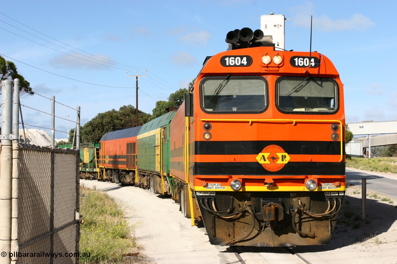 060113 2438
Thevenard, at the Gypsum Resources Australian (GRA) gypsum unloading site, 1604 leads a triple consist of Clyde Engineering EMD JL22C model 1600 / NJ class combination of 1604 serial 71-731 and originally NJ 4, NJ 3 serial 71-730 and 1601 serial 71-728 class leader NJ 1, all three units started on the Central Australia Railway in 1971 and were transferred to the Eyre Peninsula in 1981. 1604 and 1601 both renumbered in 2004. Friday 13th January 2006.
Keywords: 1600-class;1604;71-731;Clyde-Engineering-Granville-NSW;EMD;JL22C;NJ-class;NJ4;