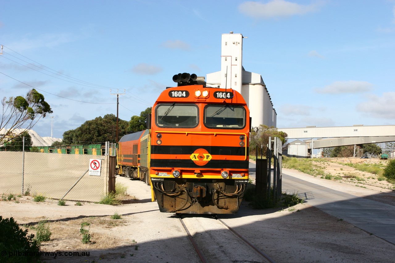 060113 2440
Thevenard, at the Gypsum Resources Australian (GRA) gypsum unloading site, 1604 leads a triple consist of Clyde Engineering EMD JL22C model 1600 / NJ class combination of 1604 serial 71-731 and originally NJ 4, NJ 3 serial 71-730 and 1601 serial 71-728 class leader NJ 1, all three units started on the Central Australia Railway in 1971 and were transferred to the Eyre Peninsula in 1981. 1604 and 1601 both renumbered in 2004. Friday 13th January 2006.
Keywords: 1600-class;1604;Clyde-Engineering-Granville-NSW;EMD;JL22C;71-731;NJ-class;NJ4;