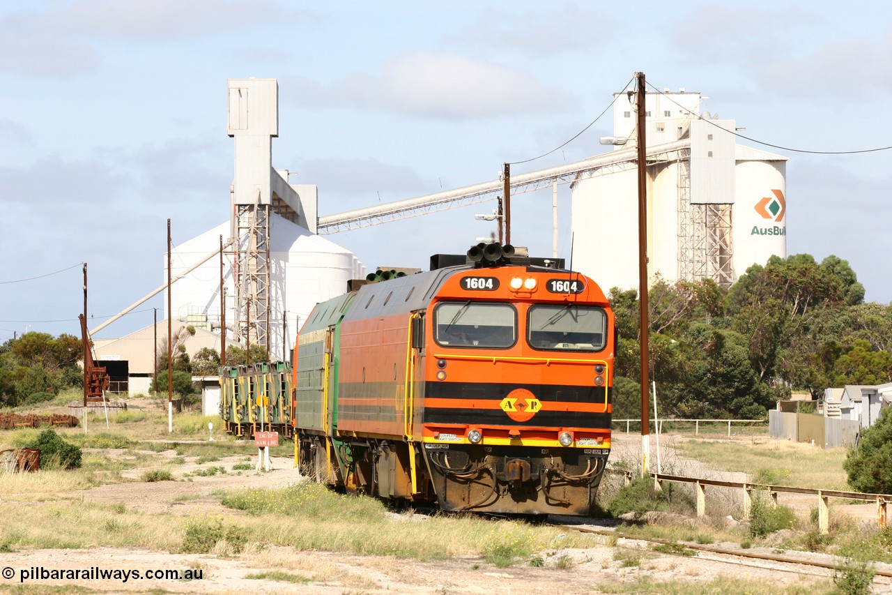 060113 2468
Thevenard, narrow gauge loco 1604 departs the yard with empty train 6DD3, 1604 leads a triple consist of Clyde Engineering built EMD JL22C model 1600 / NJ class combination of 1604 serial 71-731 and originally NJ 4, NJ 3 serial 71-730 and 1601 serial 71-728 the original class leader NJ 1, all three units started on the Central Australia Railway in 1971 and were transferred to the Eyre Peninsula in 1981. 1604 and 1601 both renumbered in 2004. 13th January 2006.
Keywords: 1600-class;1604;71-731;Clyde-Engineering-Granville-NSW;EMD;JL22C;NJ-class;NJ4;