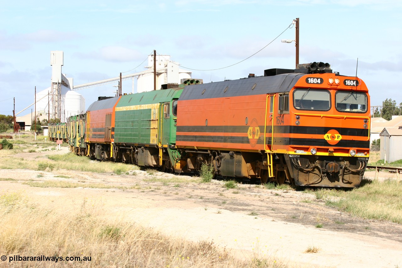 060113 2473
Thevenard, narrow gauge loco 1604 departs the yard with empty train 6DD3, 1604 leads a triple consist of Clyde Engineering built EMD JL22C model 1600 / NJ class combination of 1604 serial 71-731 and originally NJ 4, NJ 3 serial 71-730 and 1601 serial 71-728 the original class leader NJ 1, all three units started on the Central Australia Railway in 1971 and were transferred to the Eyre Peninsula in 1981. 1604 and 1601 both renumbered in 2004. 13th January 2006.
Keywords: 1600-class;1604;Clyde-Engineering-Granville-NSW;EMD;JL22C;71-731;NJ-class;NJ4;