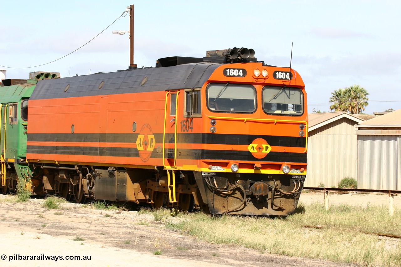 060113 2474
Thevenard, narrow gauge loco 1604 departs the yard with empty train 6DD3, 1604 leads a triple consist of Clyde Engineering built EMD JL22C model 1600 / NJ class combination of 1604 serial 71-731 and originally NJ 4, NJ 3 serial 71-730 and 1601 serial 71-728 the original class leader NJ 1, all three units started on the Central Australia Railway in 1971 and were transferred to the Eyre Peninsula in 1981. 1604 and 1601 both renumbered in 2004. 13th January 2006.
Keywords: 1600-class;1604;Clyde-Engineering-Granville-NSW;EMD;JL22C;71-731;NJ-class;NJ4;