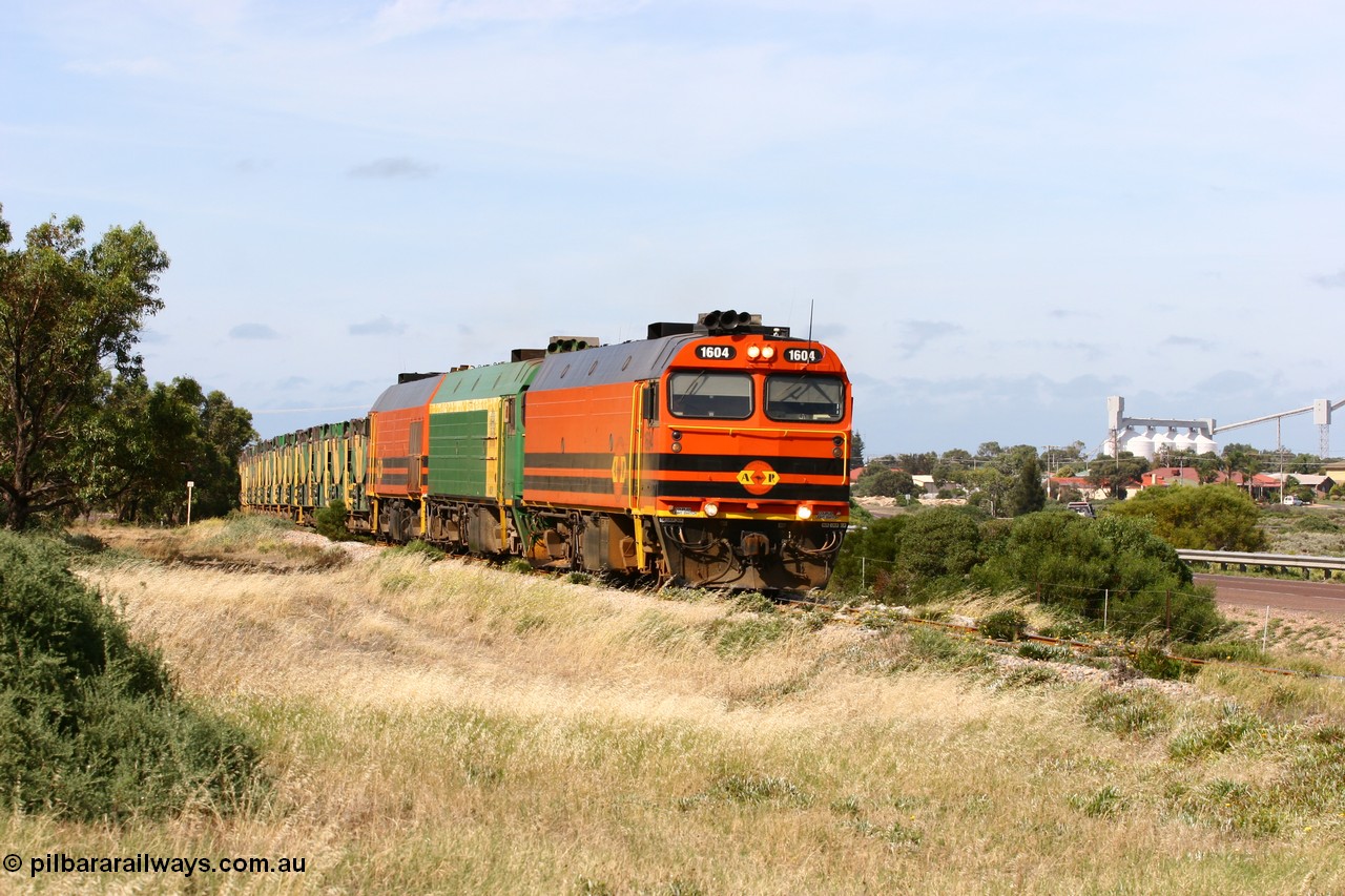 060113 2477
Thevenard, empty gypsum train 6DD3 lead by narrow gauge loco 1604 with a triple consist of Clyde Engineering built EMD JL22C model 1600 / NJ class combination of 1604 serial 71-731 and originally NJ 4, NJ 3 serial 71-730 and 1601 serial 71-728 the original class leader NJ 1, all three units started on the Central Australia Railway in 1971 and were transferred to the Eyre Peninsula in 1981. 1604 and 1601 both renumbered in 2004 [url=https://goo.gl/maps/3dLGGj7AFkE82J4A8]GeoData[/url]. 13th January 2006.
Keywords: 1600-class;1604;Clyde-Engineering-Granville-NSW;EMD;JL22C;71-731;NJ-class;NJ4;