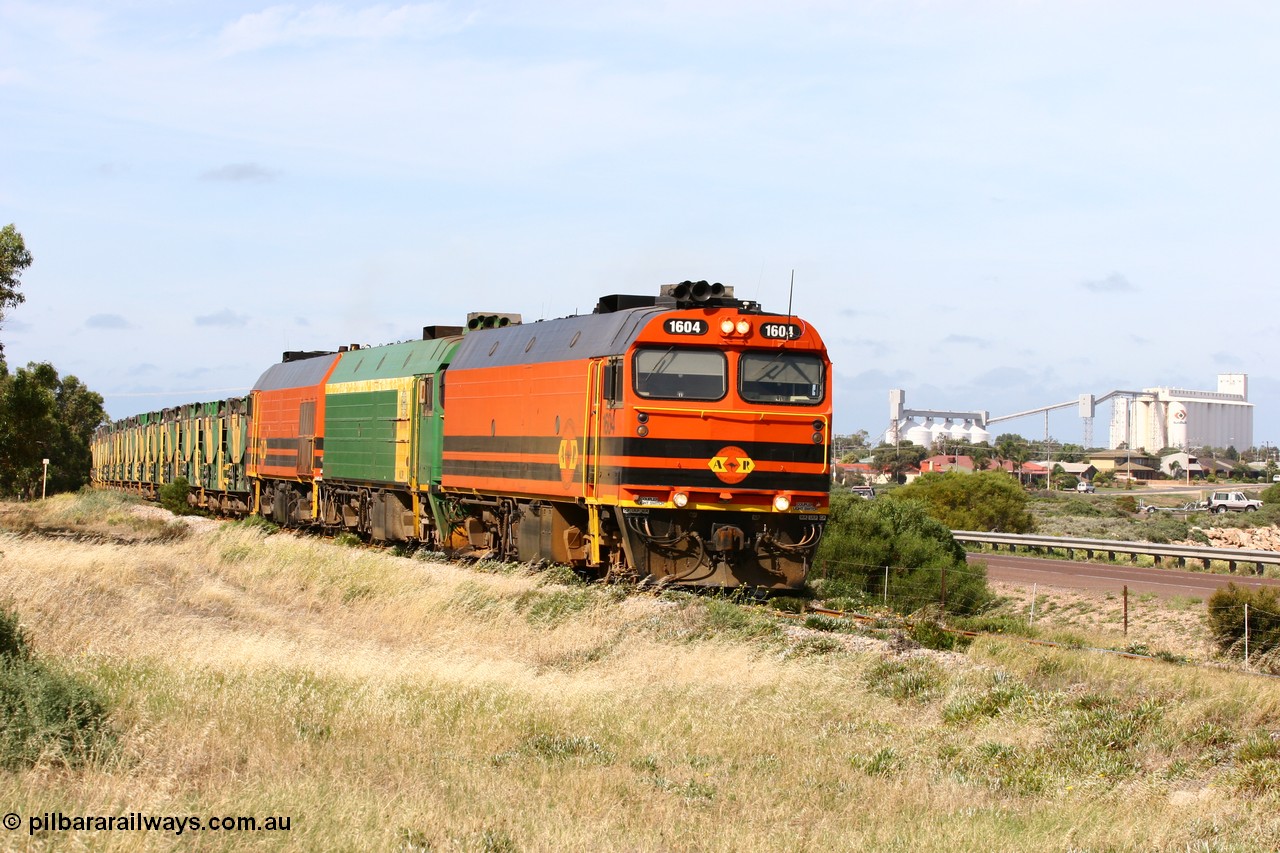 060113 2478
Thevenard, empty gypsum train 6DD3 lead by narrow gauge loco 1604 with a triple consist of Clyde Engineering built EMD JL22C model 1600 / NJ class combination of 1604 serial 71-731 and originally NJ 4, NJ 3 serial 71-730 and 1601 serial 71-728 the original class leader NJ 1, all three units started on the Central Australia Railway in 1971 and were transferred to the Eyre Peninsula in 1981. 1604 and 1601 both renumbered in 2004 [url=https://goo.gl/maps/3dLGGj7AFkE82J4A8]GeoData[/url]. 13th January 2006.
Keywords: 1600-class;1604;Clyde-Engineering-Granville-NSW;EMD;JL22C;71-731;NJ-class;NJ4;