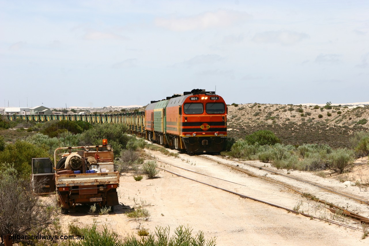 060113 2484
Kevin, ARG 1600 class narrow gauge loco 1604 a Clyde Engineering built EMD model JL22C serial 71-731, originally built for the Central Australia Railway in 1971, transferred to the Eyre Peninsula in 1981 arrives with empty gypsum train 6DD3. 13th January 2006.
Keywords: 1600-class;1604;Clyde-Engineering-Granville-NSW;EMD;JL22C;71-731;NJ-class;NJ4;