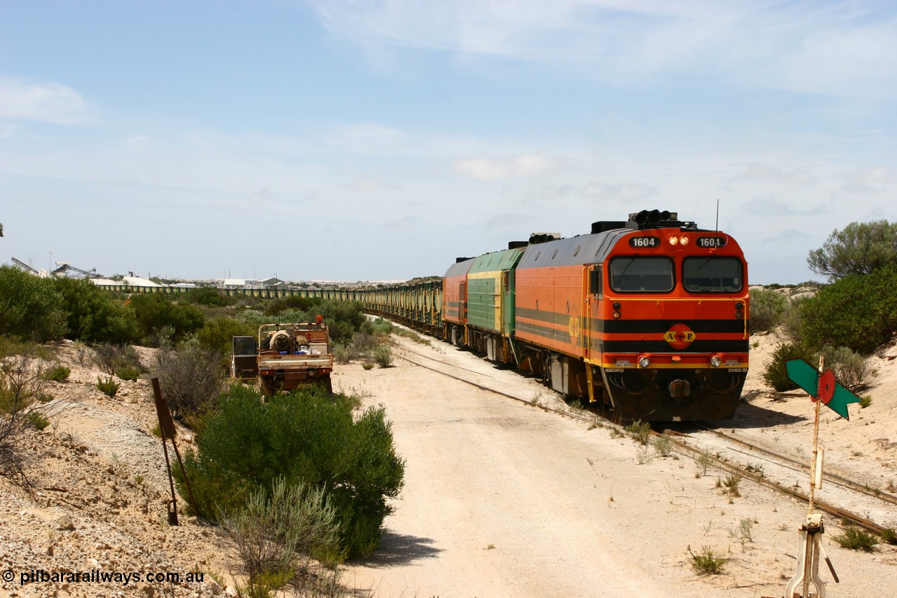 060113 2487
Kevin, ARG 1600 class narrow gauge loco 1604 a Clyde Engineering built EMD model JL22C serial 71-731, originally built for the Central Australia Railway in 1971, transferred to the Eyre Peninsula in 1981 arrives with empty gypsum train 6DD3. 13th January 2006.
Keywords: 1600-class;1604;Clyde-Engineering-Granville-NSW;EMD;JL22C;71-731;NJ-class;NJ4;