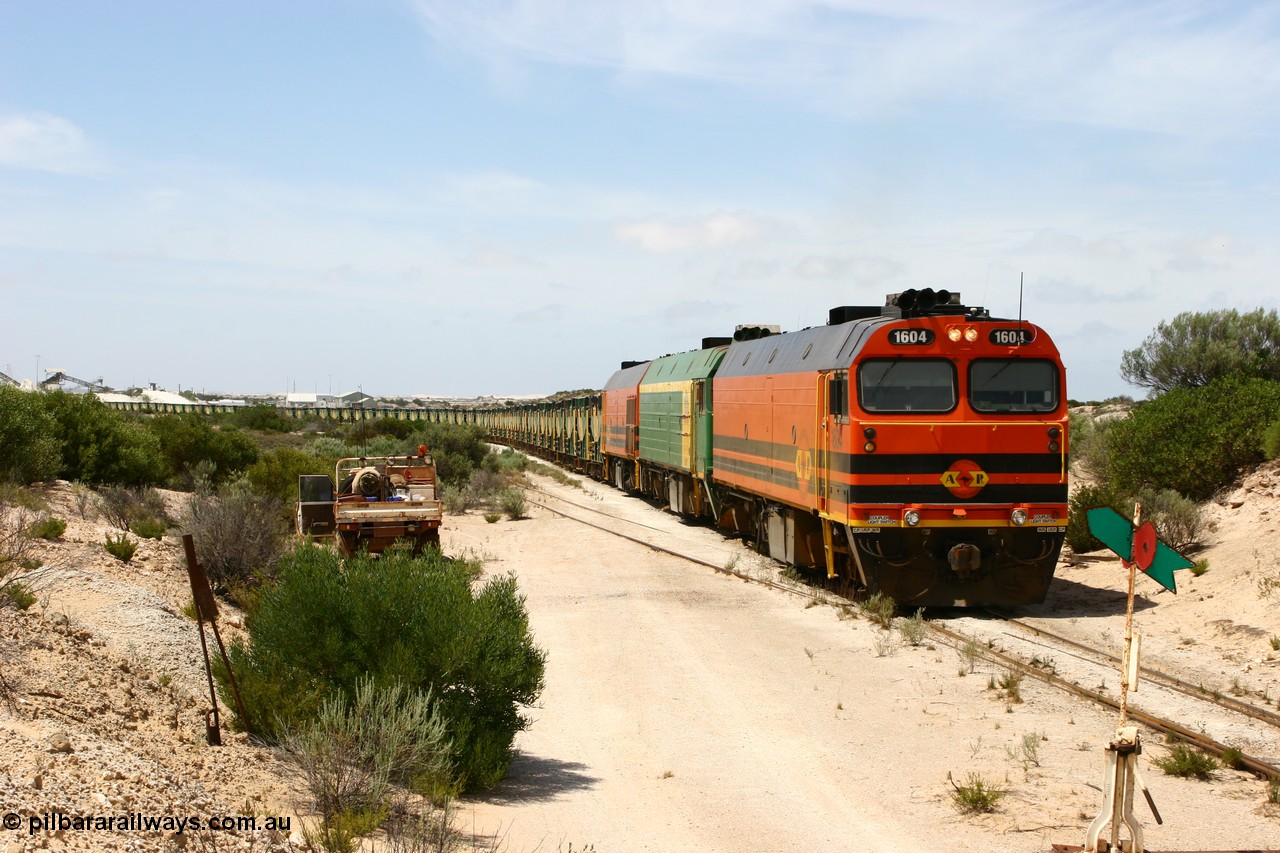 060113 2488
Kevin, ARG 1600 class narrow gauge loco 1604 a Clyde Engineering built EMD model JL22C serial 71-731, originally built for the Central Australia Railway in 1971, transferred to the Eyre Peninsula in 1981 arrives with empty gypsum train 6DD3. 13th January 2006.
Keywords: 1600-class;1604;Clyde-Engineering-Granville-NSW;EMD;JL22C;71-731;NJ-class;NJ4;