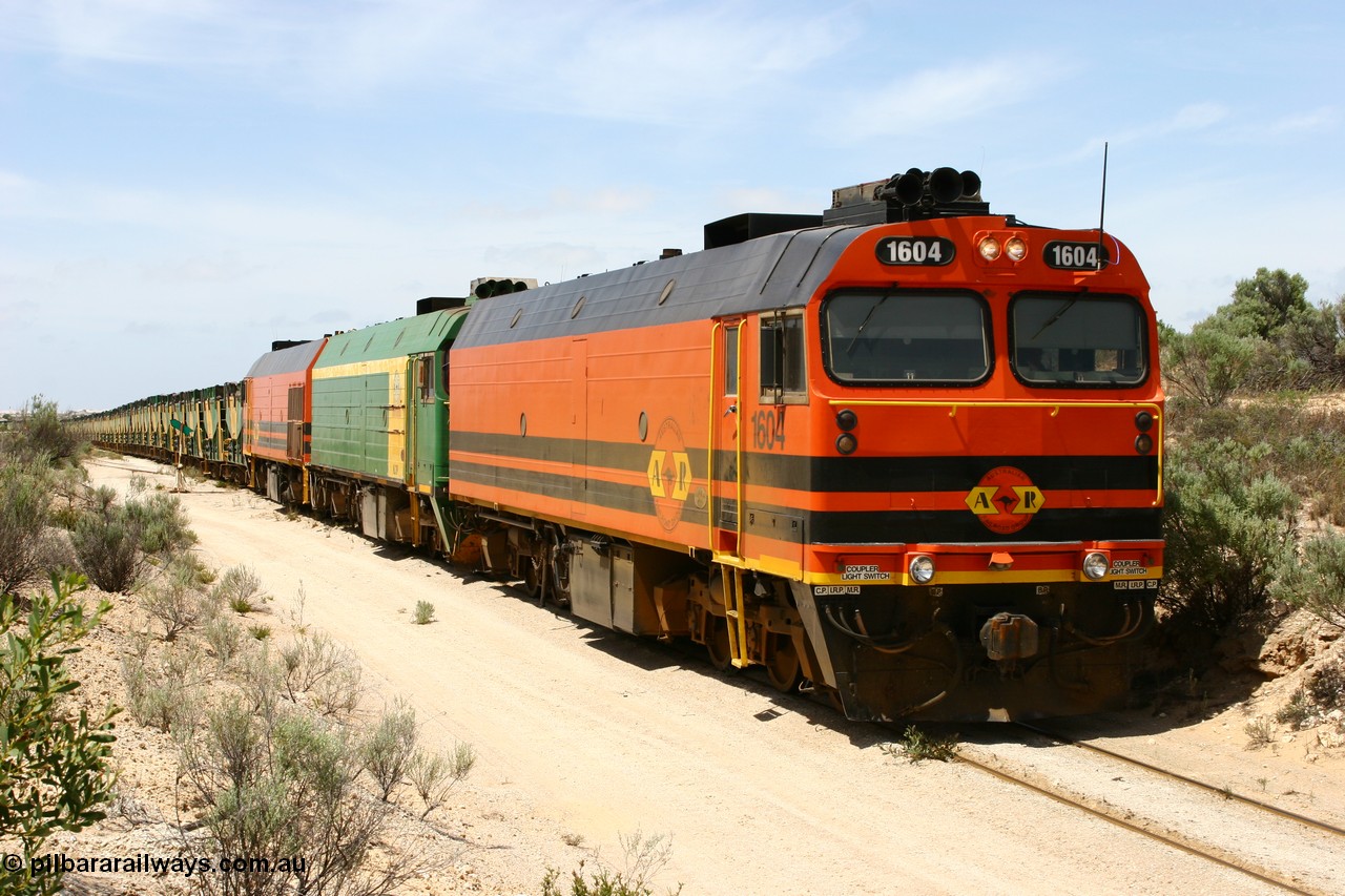 060113 2500
Kevin, empty train 6DD3 on the [url=https://goo.gl/maps/jZAuZ]stub of the now closed line to Penong[/url] shunts back onto the triangle leg to reverse the train prior to loading. 13th January 2006.
Keywords: 1600-class;1604;Clyde-Engineering-Granville-NSW;EMD;JL22C;71-731;NJ-class;NJ4;