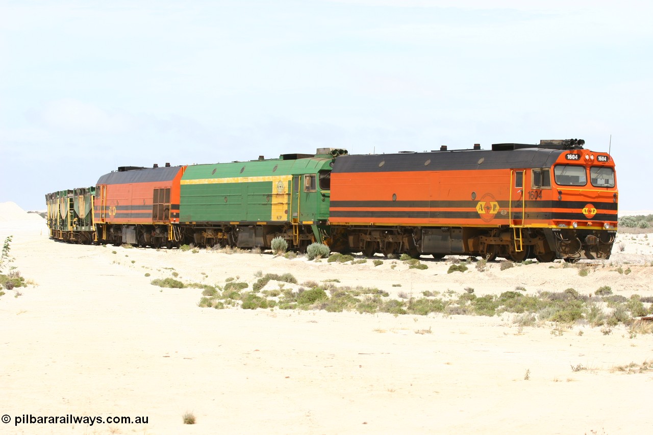 060113 2509
Kevin, empty train 6DD3 shunts back onto the triangle leg behind triple NJ/1600 class units, Clyde Engineering built EMD JL22C models, originally coded the NJ class and built for the Central Australia Railway in 1971, transferred to the Eyre Peninsula in 1981 and recoded to the 1600 class. 13th January 2006.
Keywords: 1600-class;1604;71-731;Clyde-Engineering-Granville-NSW;EMD;JL22C;NJ-class;NJ4;